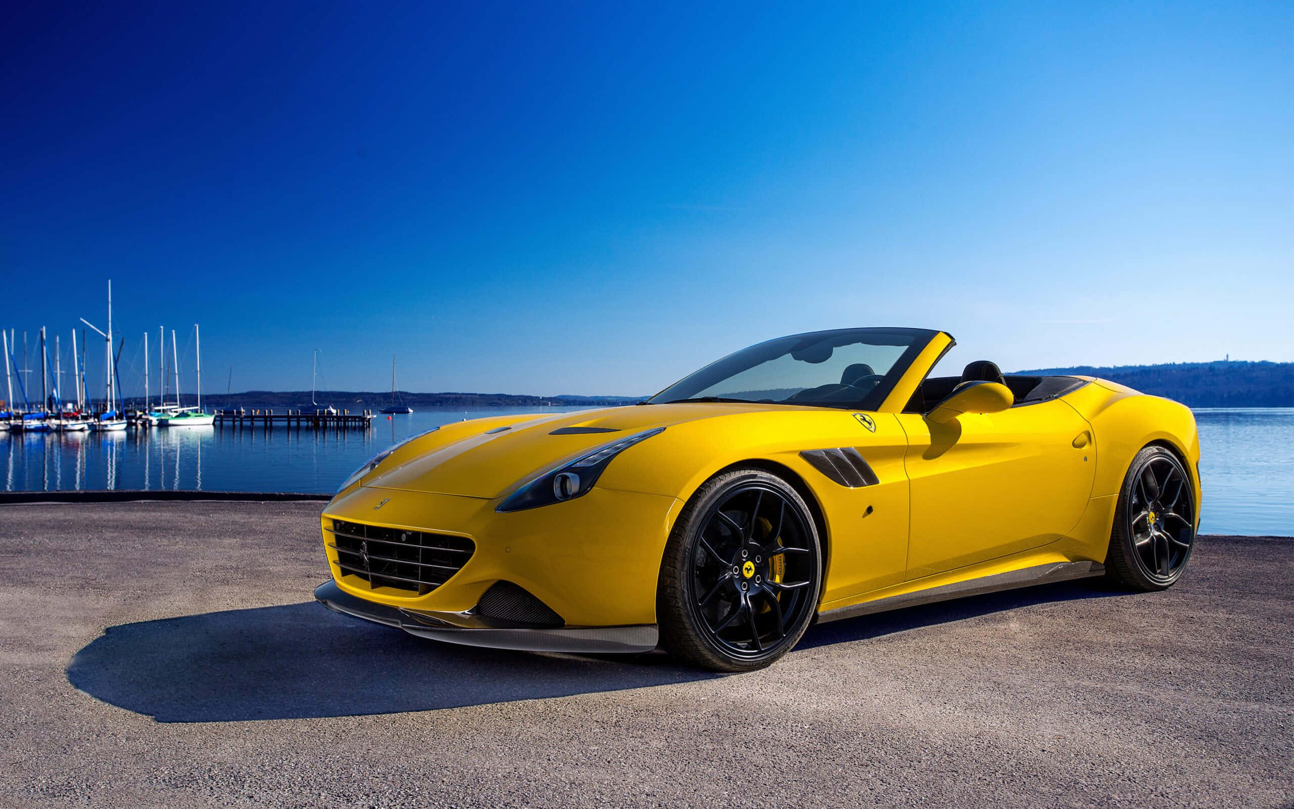 Ferrari California T, vibrant yellow, pier, 2K Desktop Wallpaper
