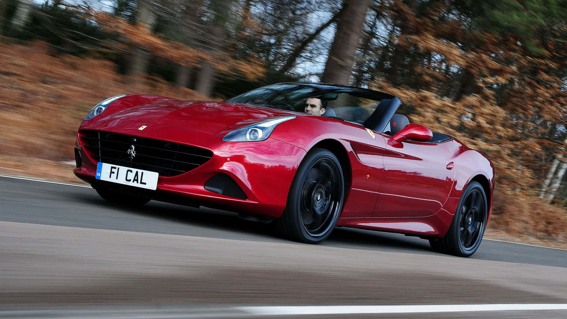 Ferrari California T, vibrant red, forest-lined road, Full HD Desktop Wallpaper