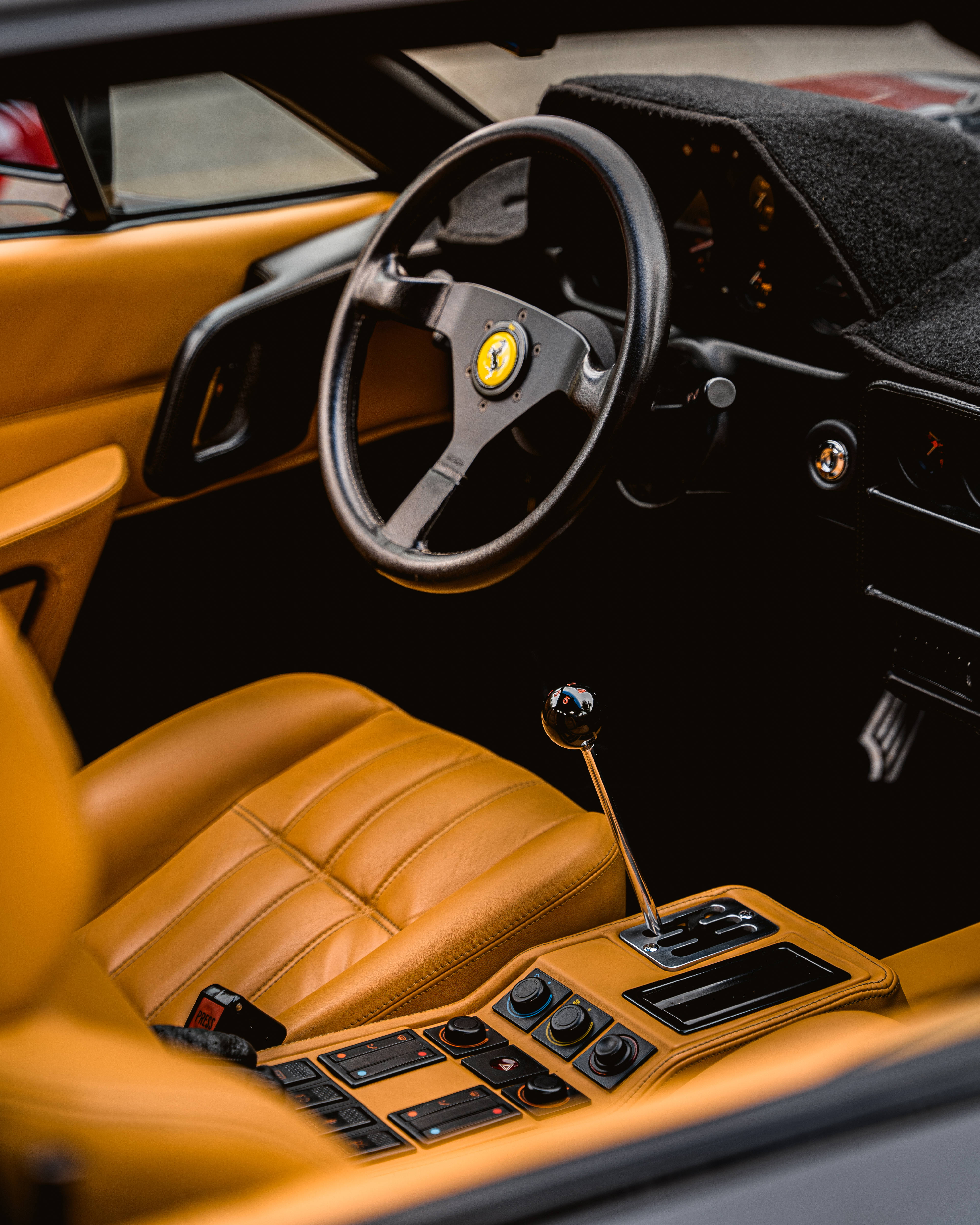 Ferrari Enzo, tan leather interior, black steering wheel, 4K Phone Wallpaper