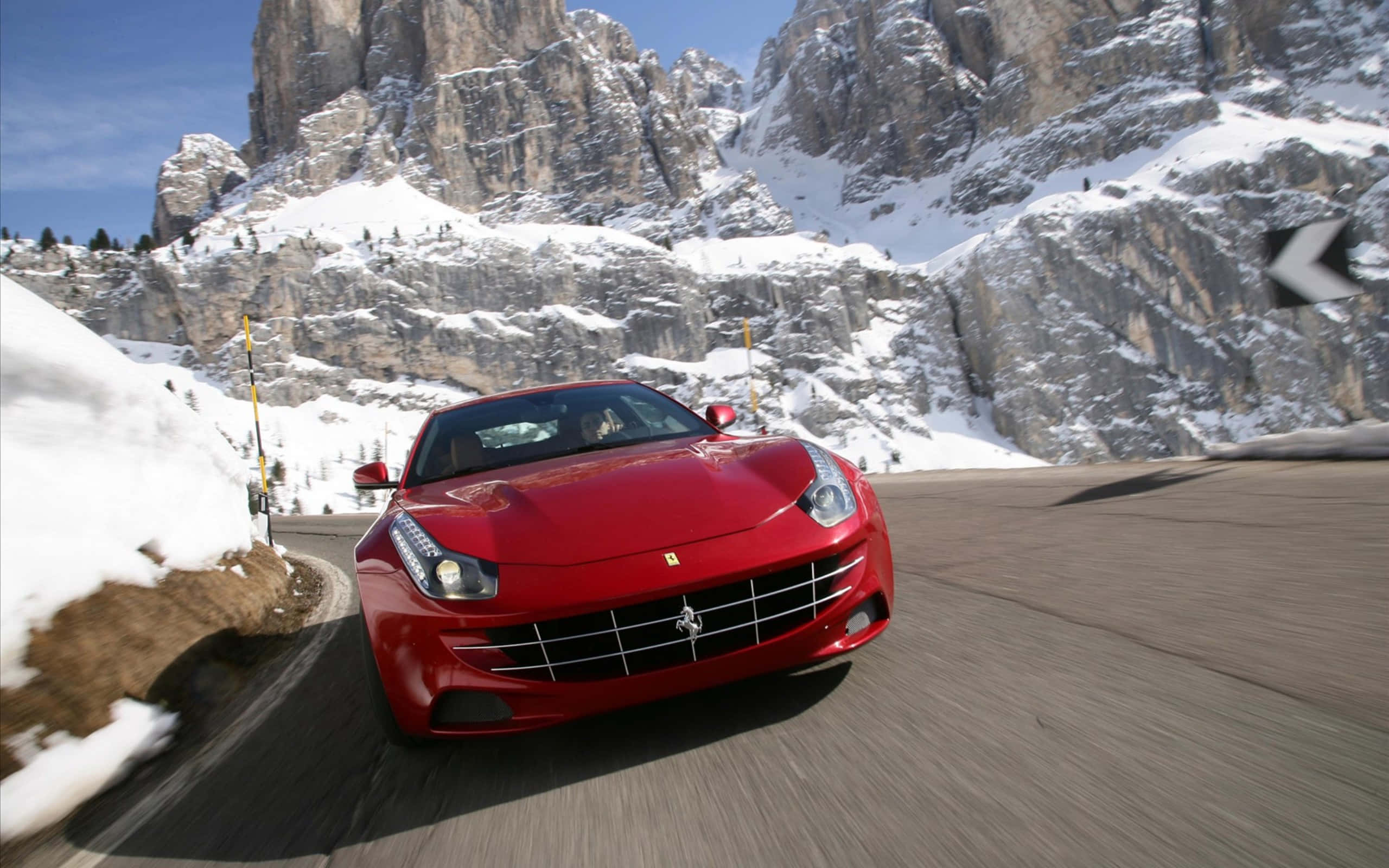 Ferrari FF, vibrant red, winding mountain road, 2K Desktop Wallpaper