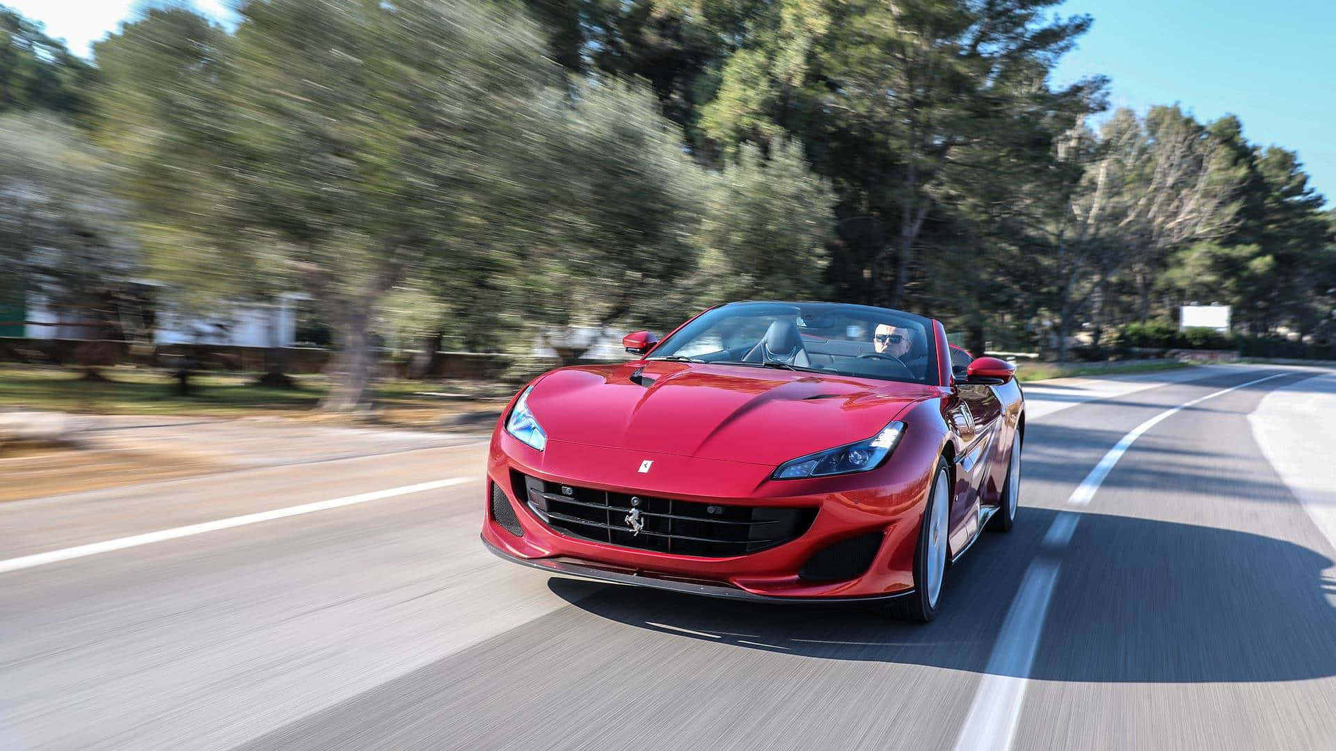 Ferrari Portofino, vibrant red, sunlit winding road, Full HD Desktop Wallpaper