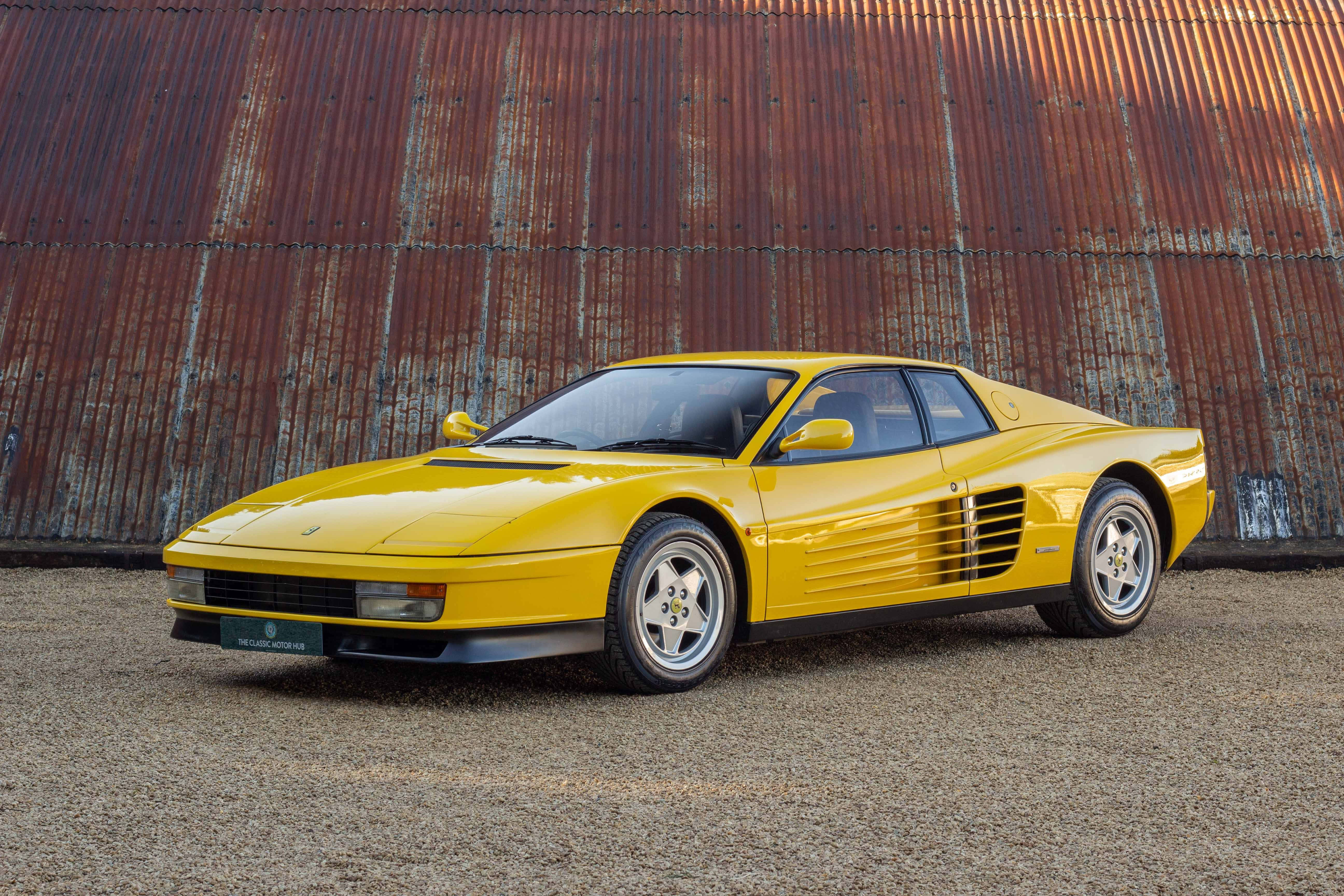 Ferrari Testarossa, vibrant yellow, golden hour light, 5K Desktop Wallpaper