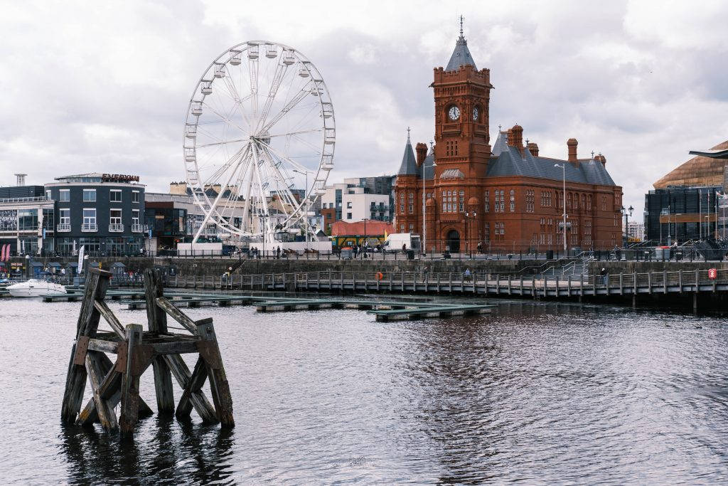 Ferris wheel, red brick clock tower, waterfront, SD Desktop Wallpaper