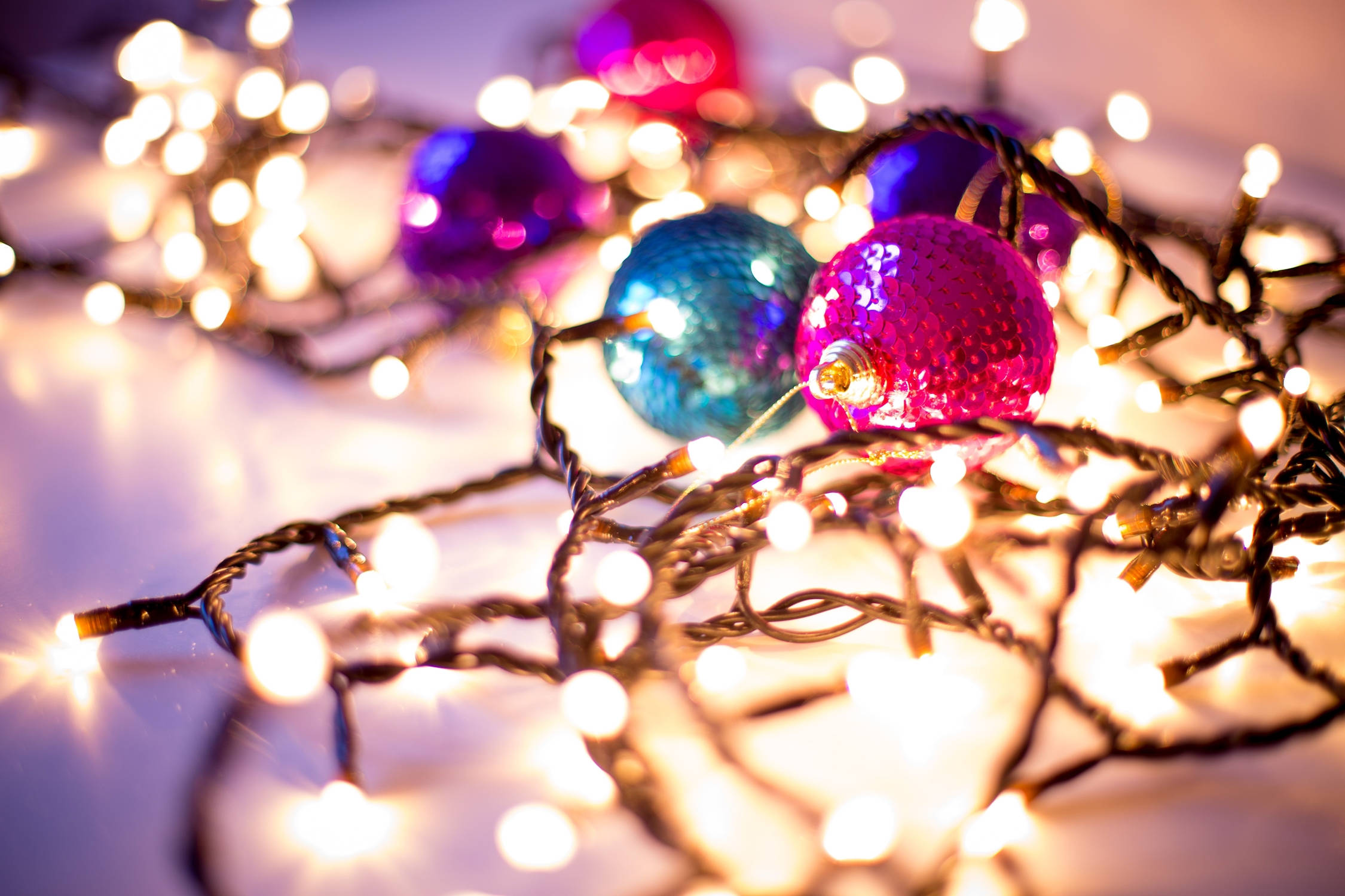 Christmas balls, yellow festive Christmas lights, shimmering pink blue and purple Christmas ornaments, Full HD Desktop Wallpaper