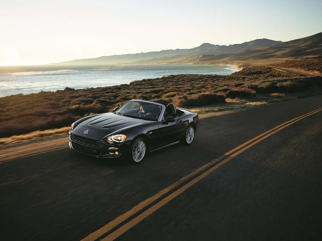 Fiat 124 Spider, black, coastal road, SD Desktop Wallpaper