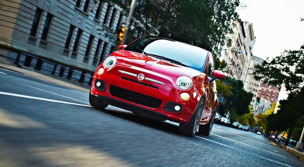 Fiat 500, vibrant red, sunlit city street, SD Desktop Wallpaper