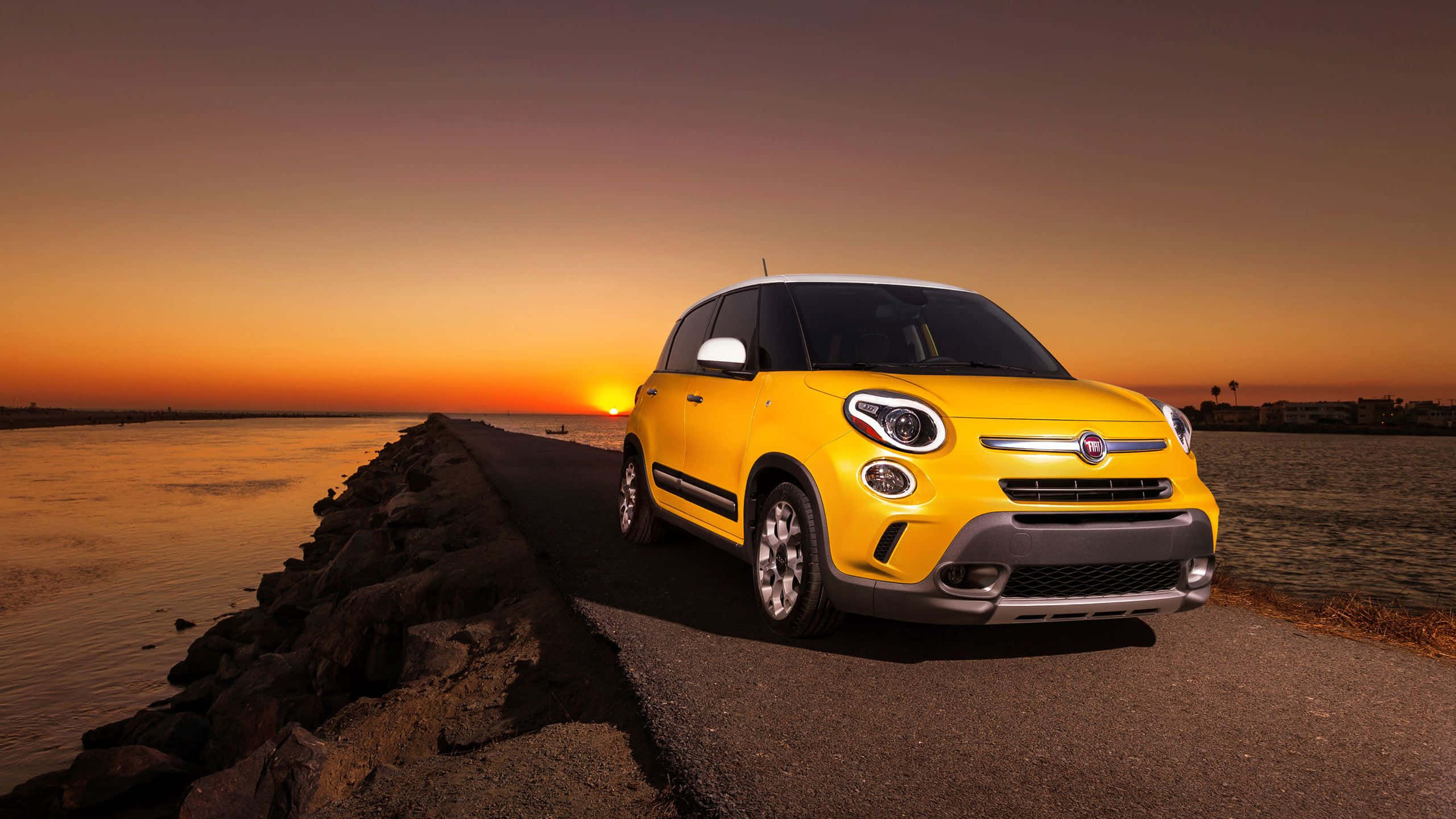 Fiat 500L, vibrant yellow, coastal road, 2K Desktop Wallpaper