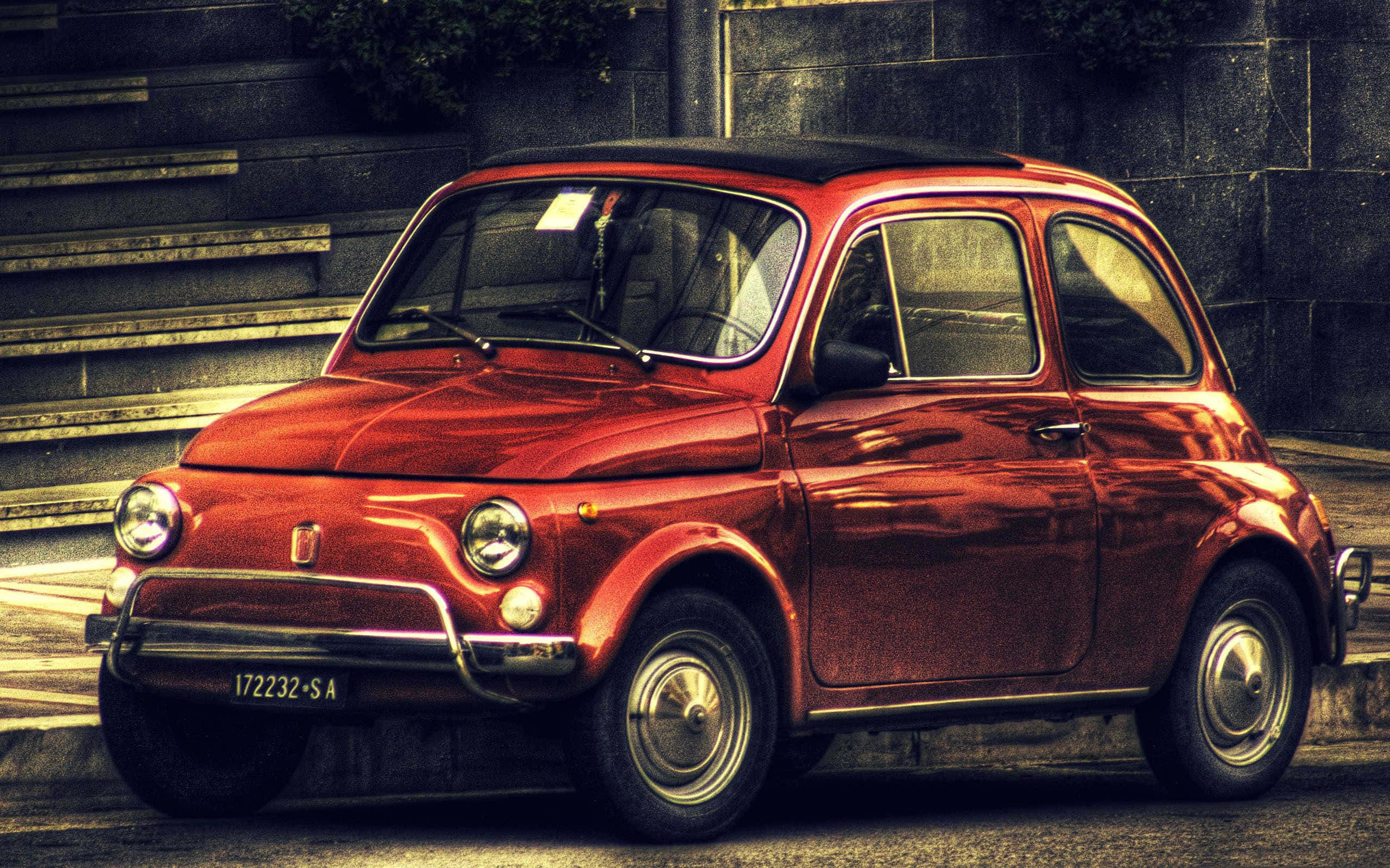 Fiat 500x, vintage red, sunlit urban street, 2K Desktop Wallpaper