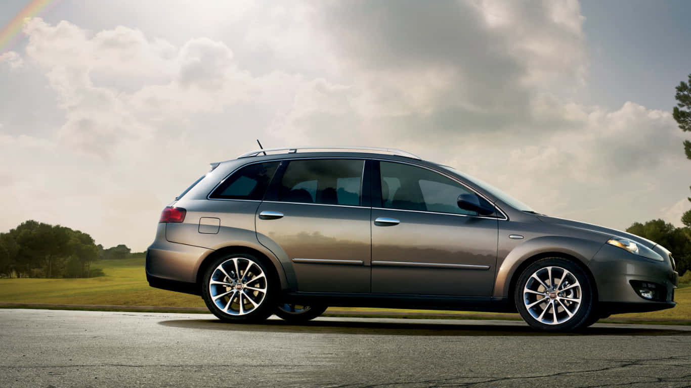 Fiat Croma, sleek silver station wagon, paved road, HD Desktop Wallpaper