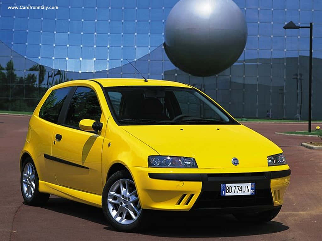 Fiat Grande Punto, bright yellow, glass building, SD Desktop Wallpaper