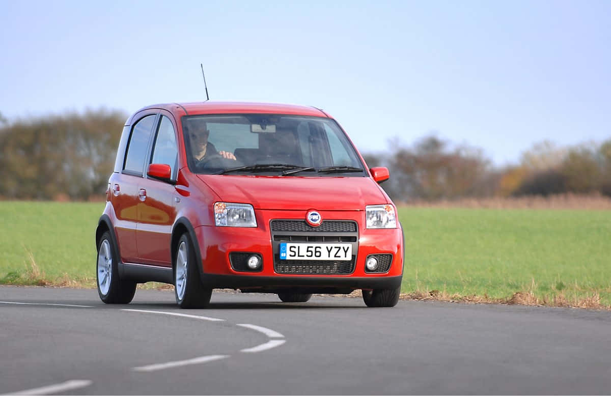 Fiat Panda, vibrant red, winding rural road, SD Desktop Wallpaper