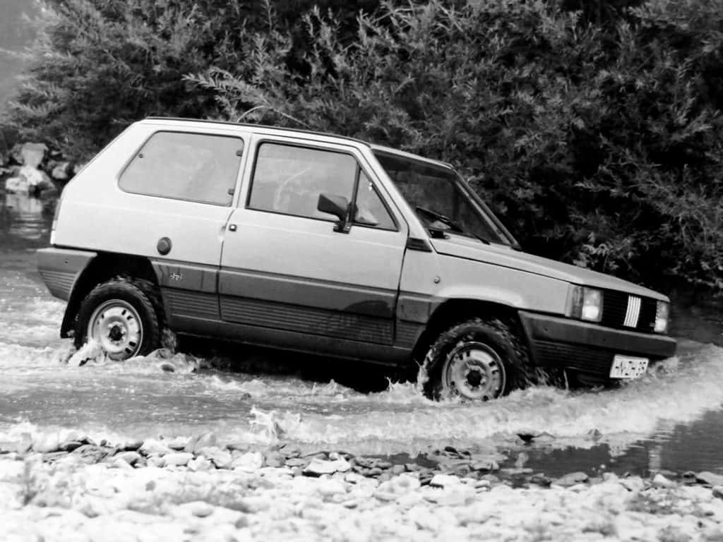 Fiat Panda, vintage compact car, shallow rocky stream, SD Desktop Wallpaper