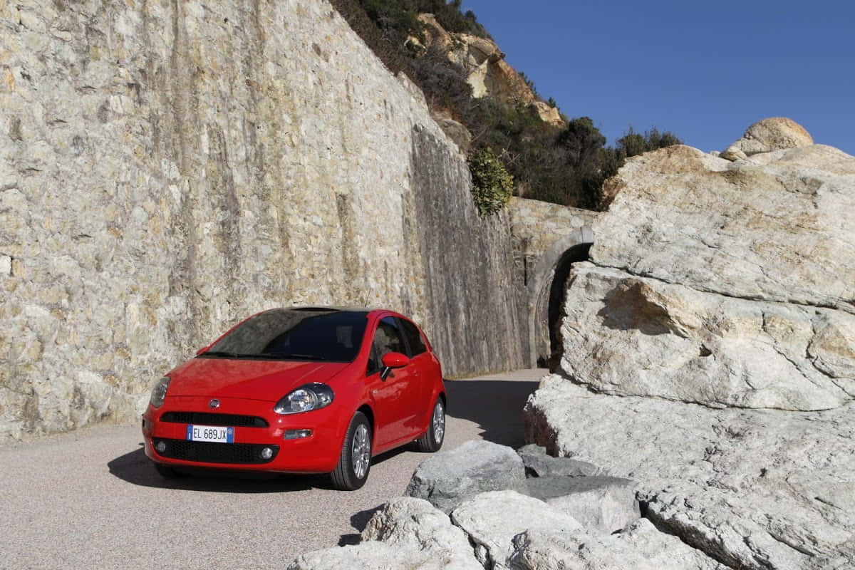 Fiat Punto, vibrant red, sunlit gravel road, SD Desktop Wallpaper