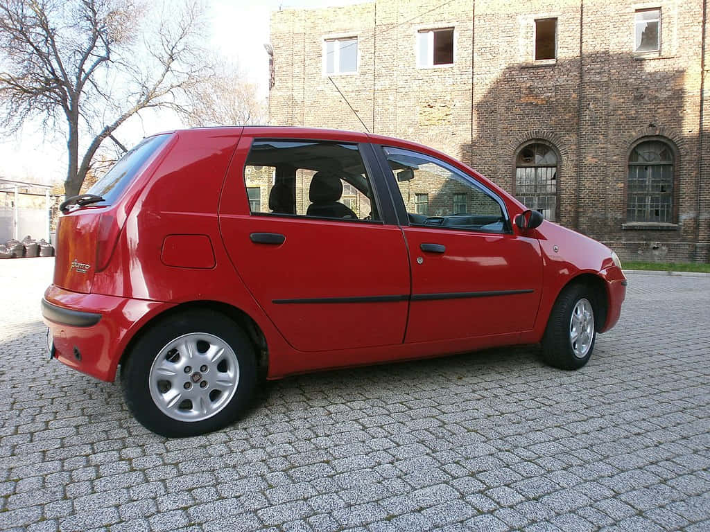 Fiat Punto, vibrant red, compact car, SD Desktop Wallpaper