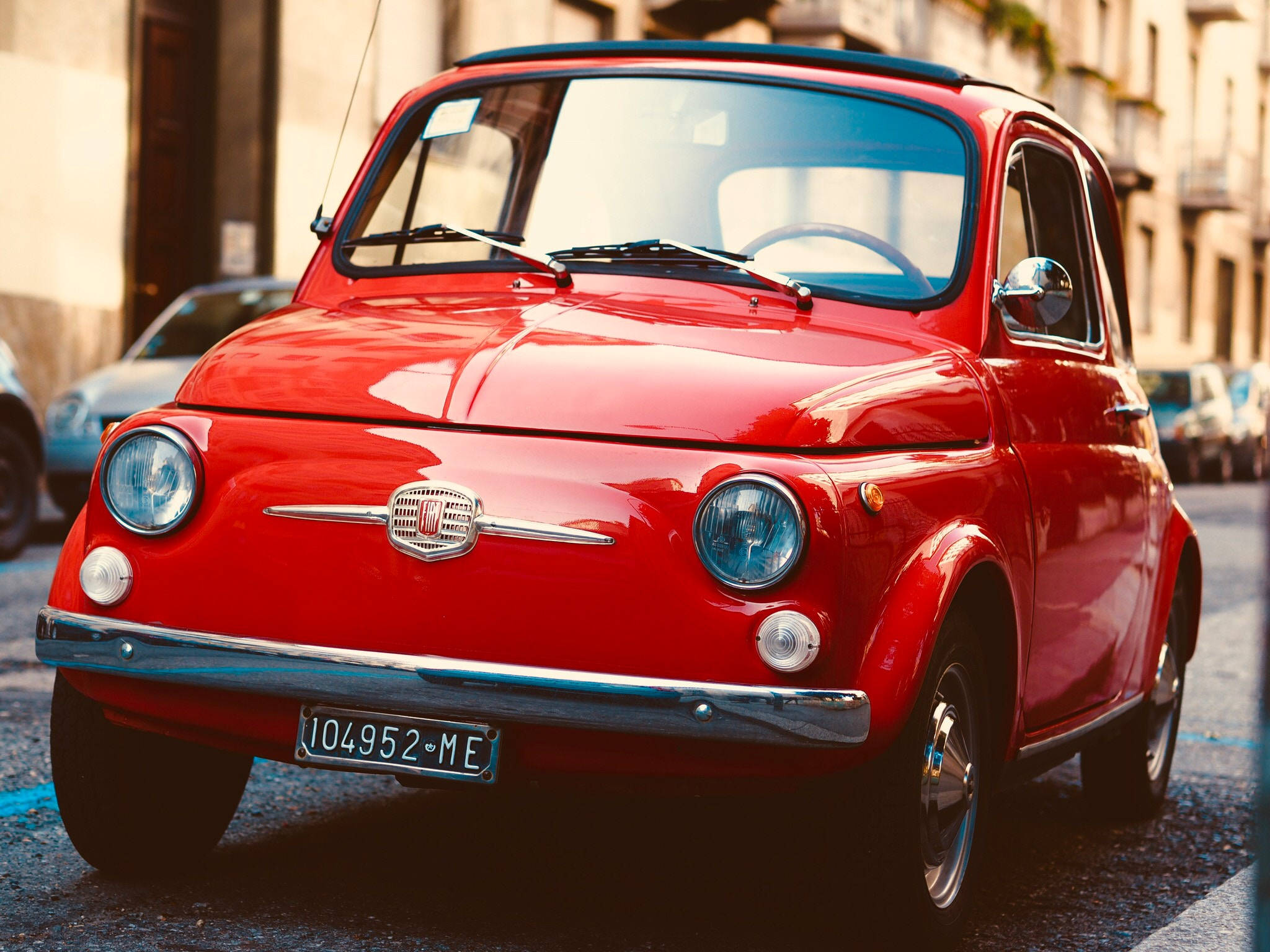Fiat 500, vibrant red, sunlit European street, Full HD Desktop Wallpaper