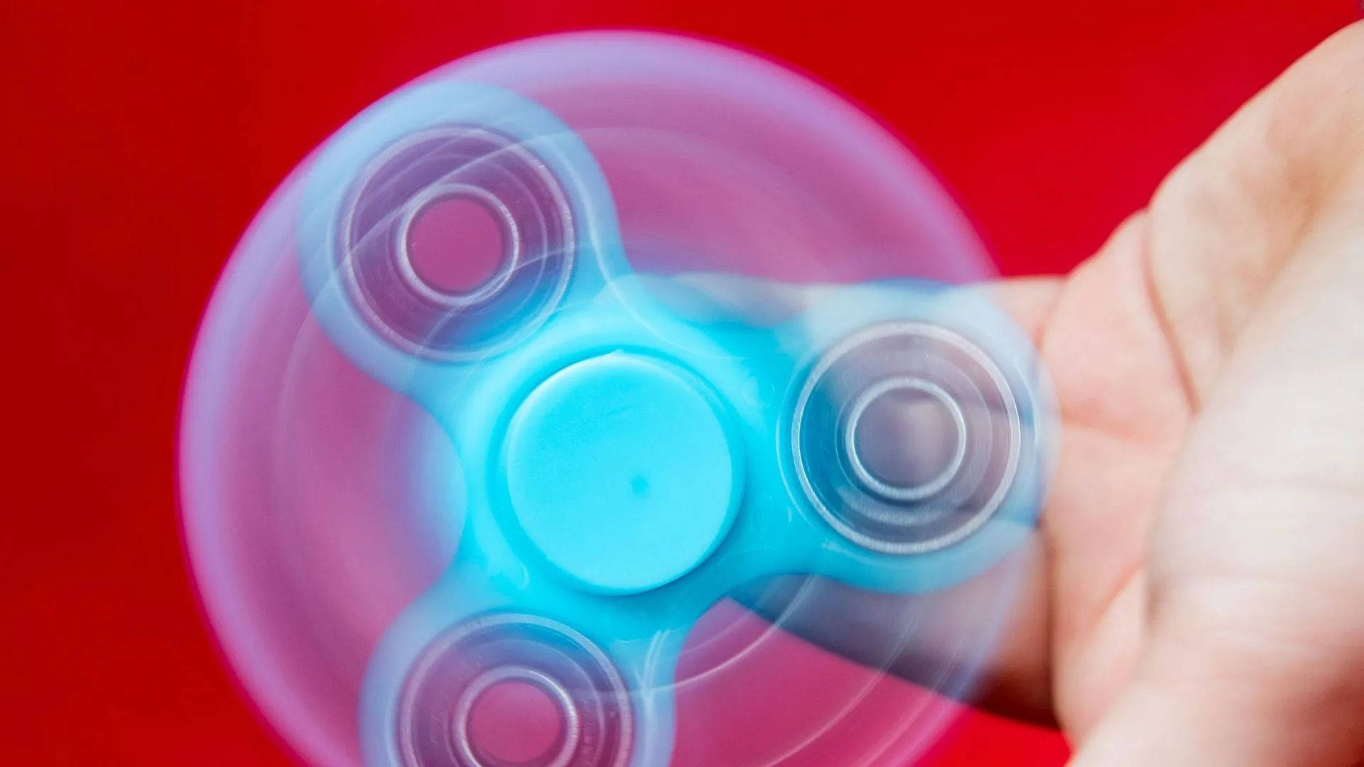 glowing blue fidget spinner, vivid red background, motion blur, Full HD Desktop Wallpaper