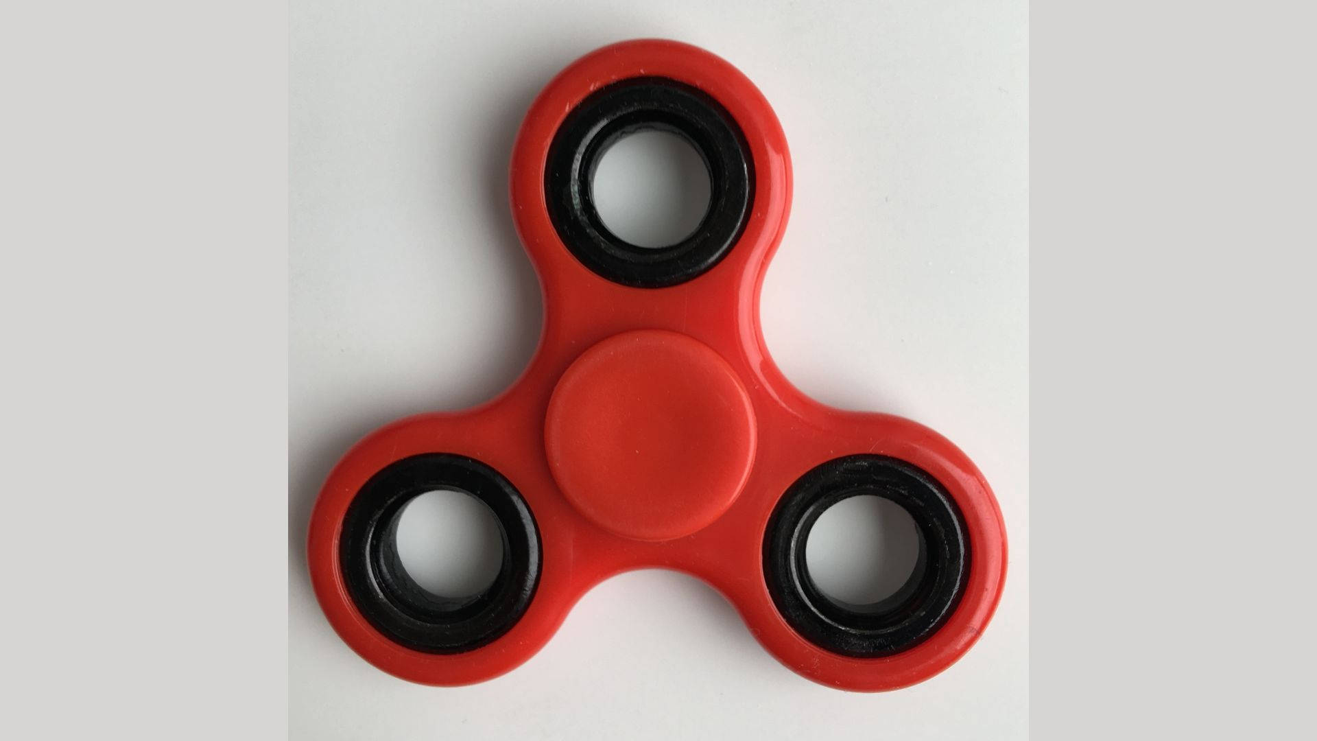 plain red fidget toy, three-pronged fidget spinner, black bearings, Full HD Desktop Wallpaper