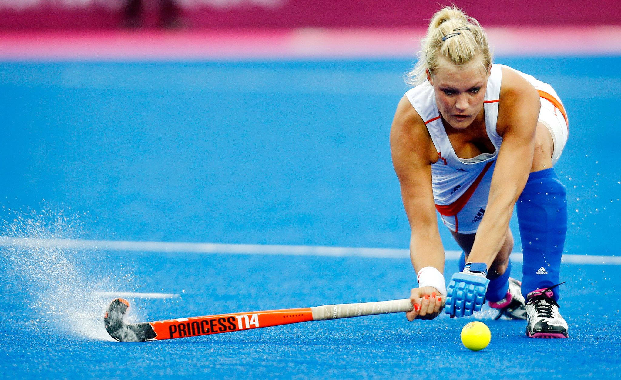 female field hockey player, white and blue gear, bright blue turf field, Full HD Desktop Wallpaper