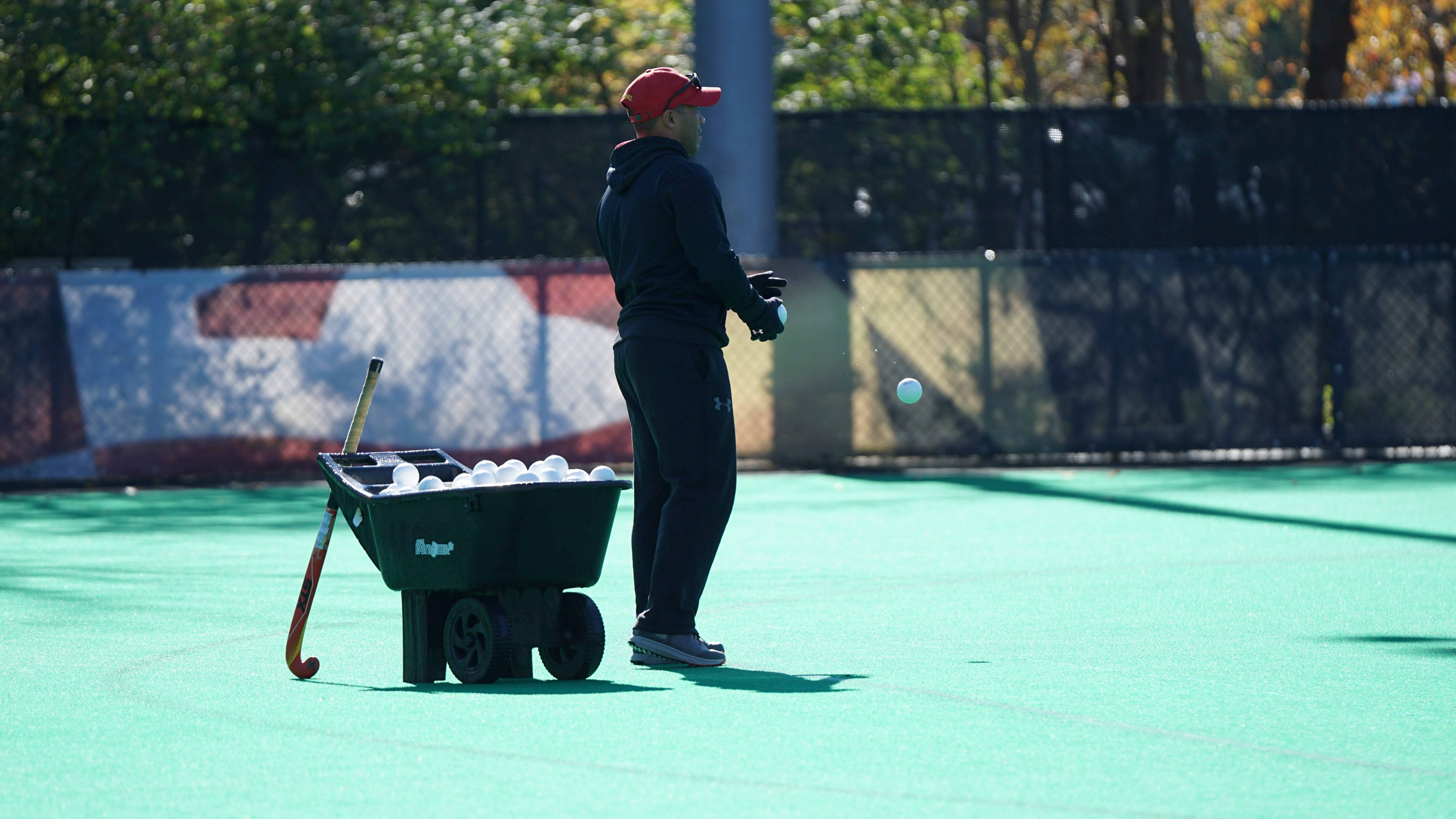 field hockey balls, wheelbarrow, red cap, 4K Desktop Wallpaper
