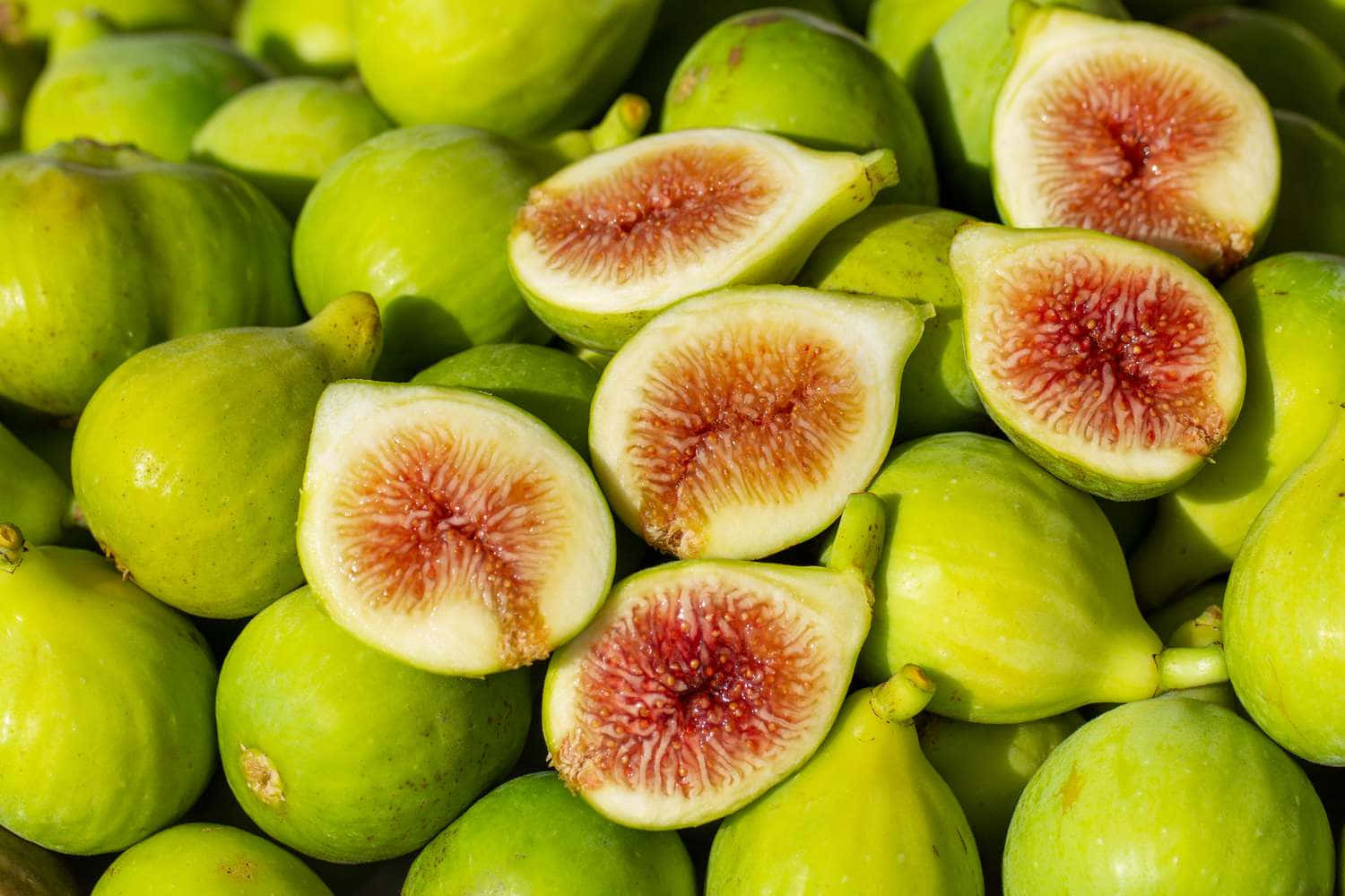 fresh green figs, sliced open, juicy pinkish-red interiors, HD Desktop Wallpaper