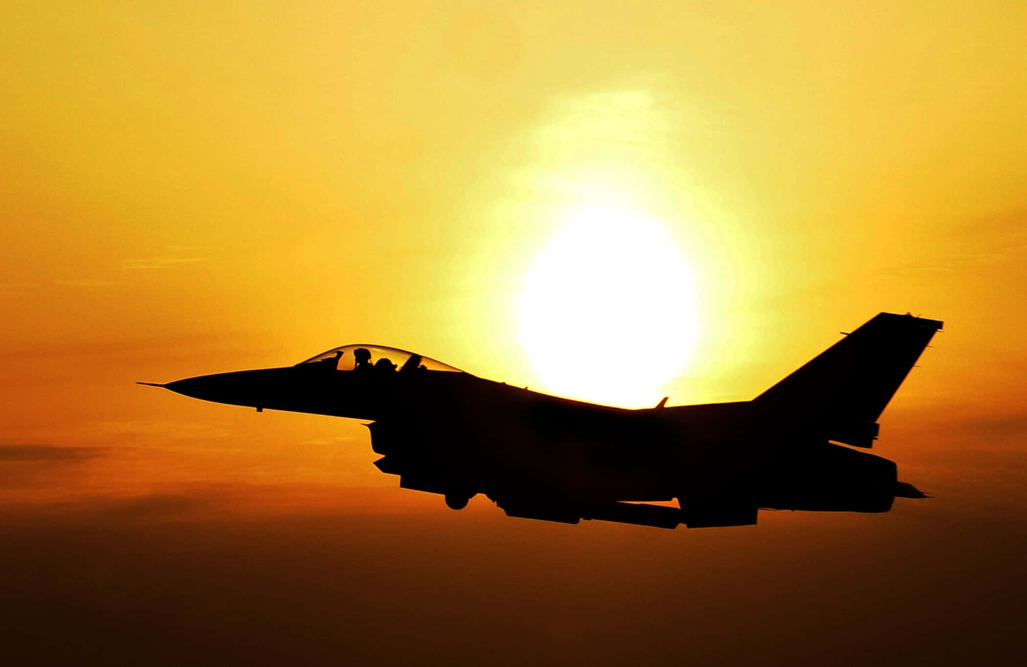 fighter jet, glowing sunset sky, warm orange and yellow hues, Full HD Desktop Wallpaper