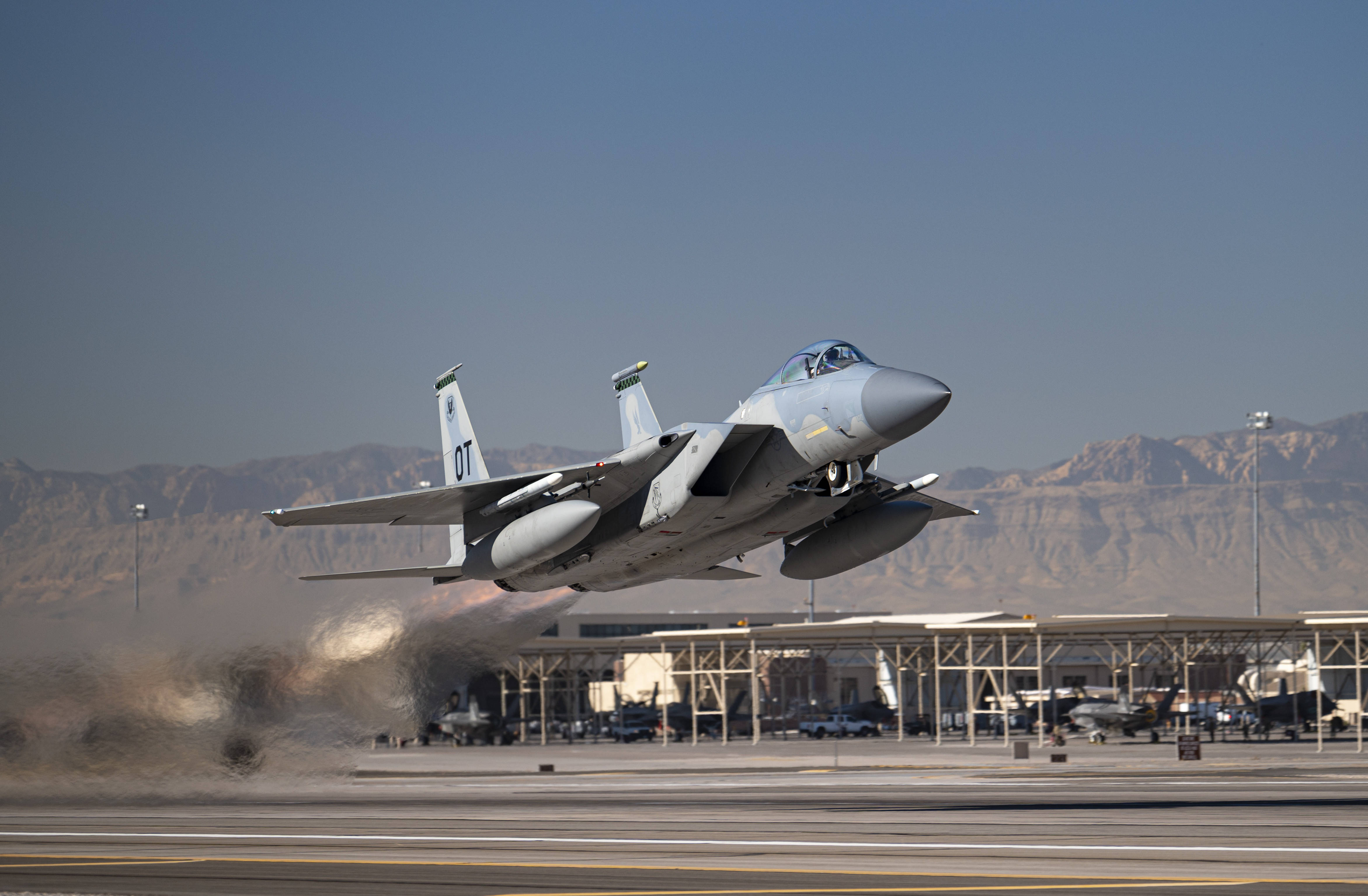 F-15 Fighter Jet, desert runway, mountains, 4K Desktop Wallpaper