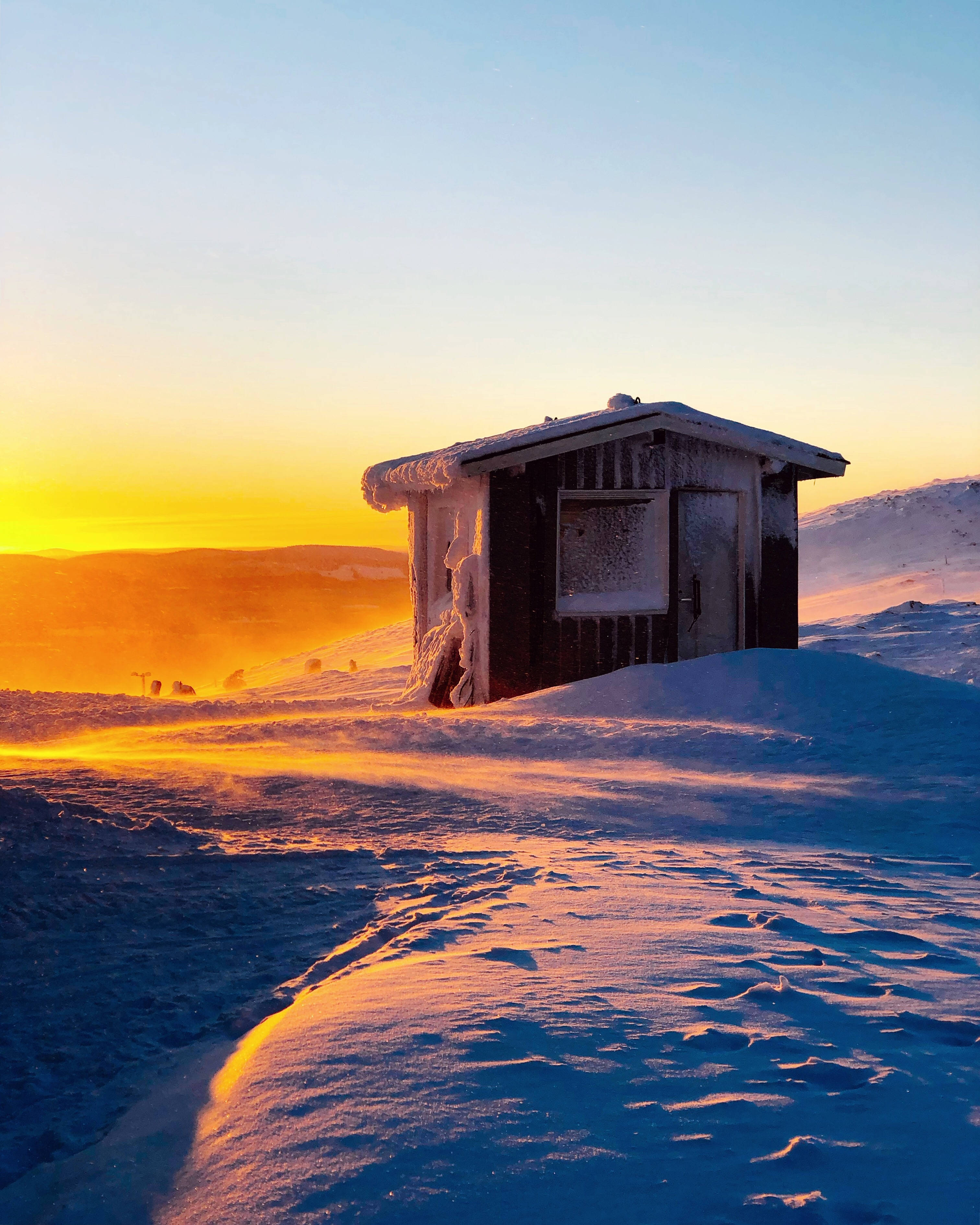 Finland, orange winter sunset, frost-covered wooden cabin, 2K Phone Wallpaper
