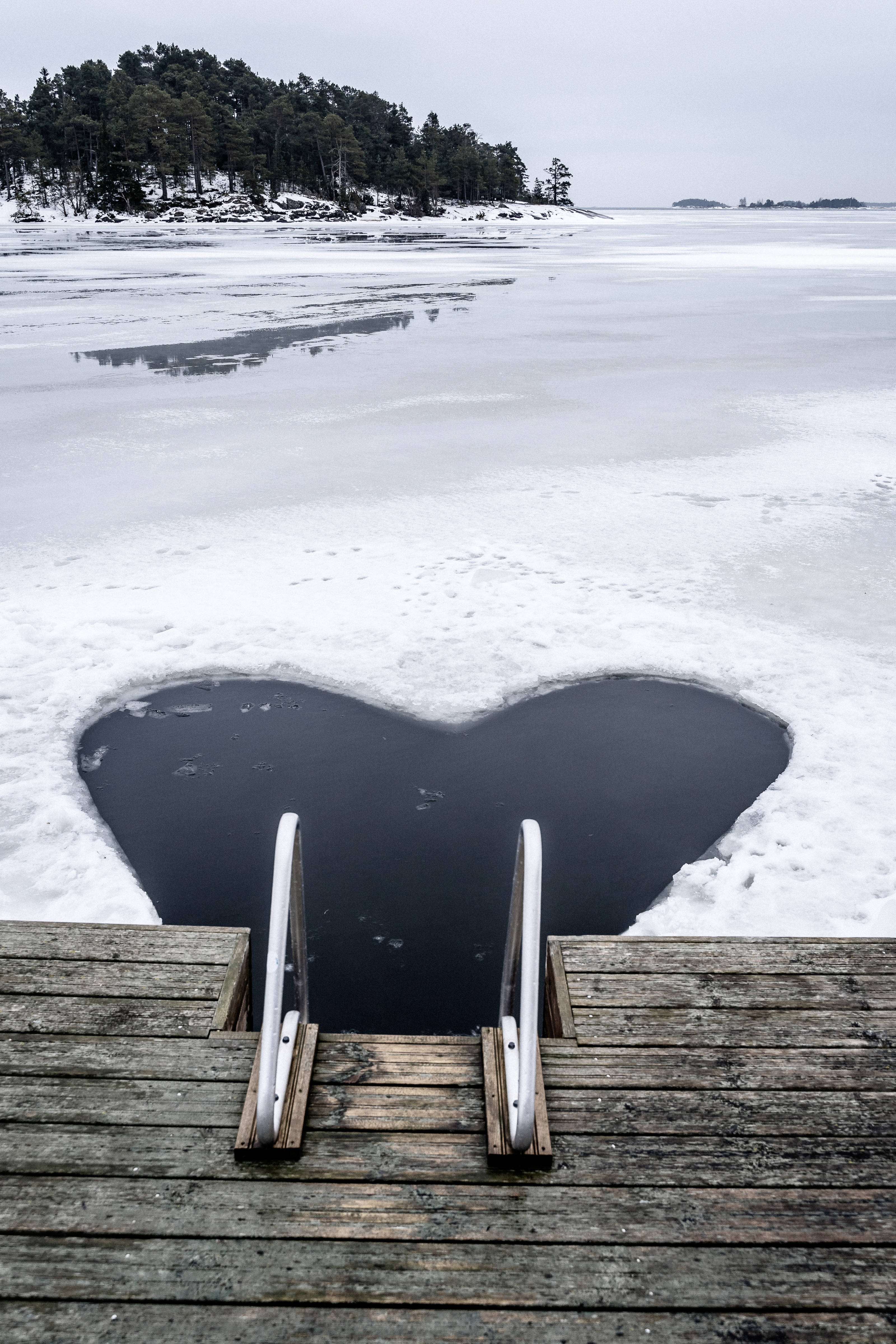 Finland, heart-shaped hole, frozen lake ice, 4K Phone Wallpaper