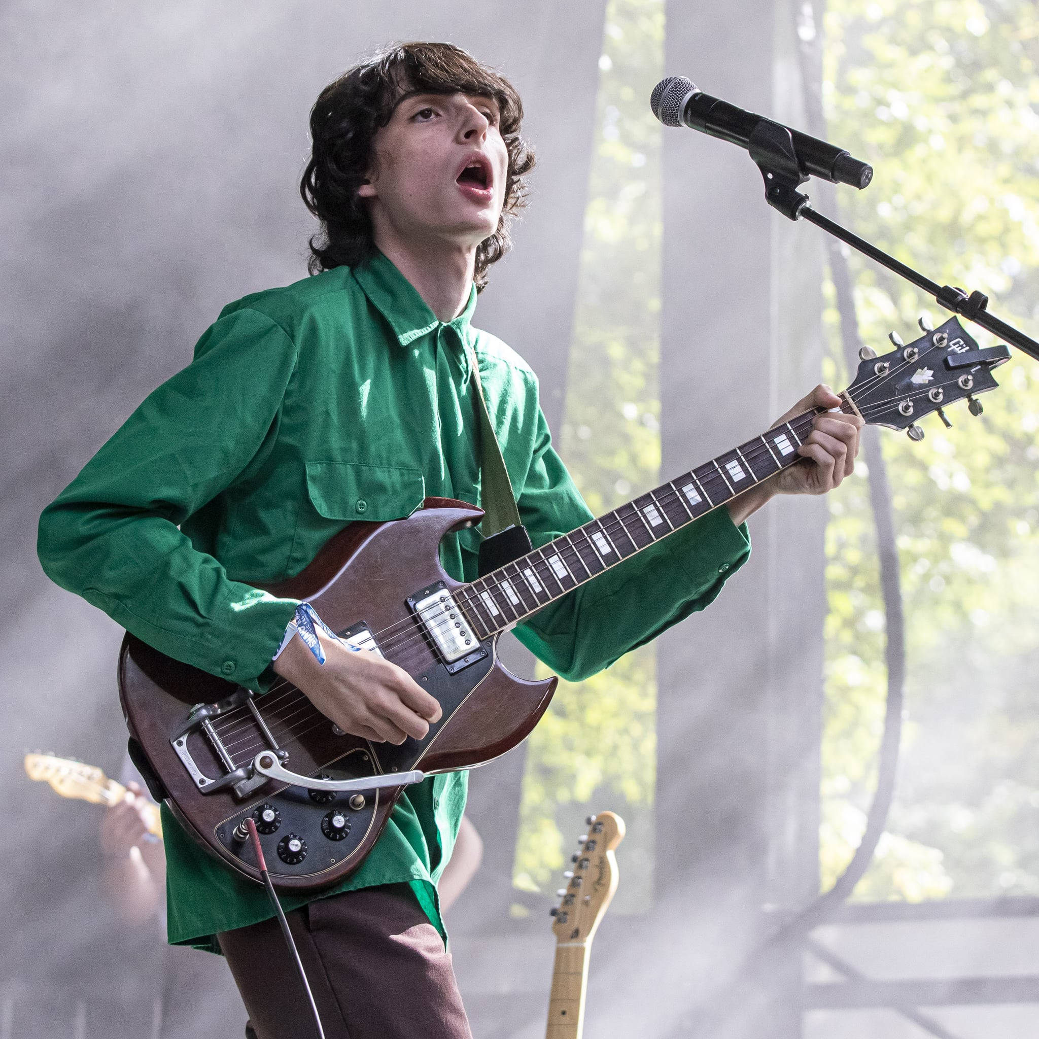 Finn Wolfhard, green shirt, brown electric guitar, Full HD Desktop Wallpaper