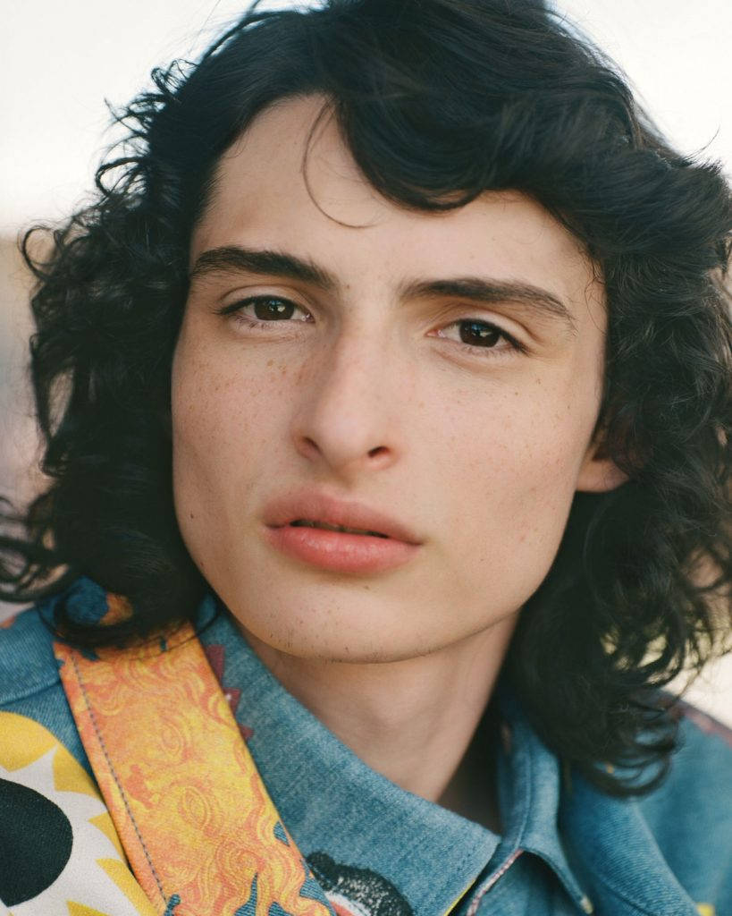 Finn Wolfhard, denim jacket, colorful patterned shirt, SD Phone Wallpaper