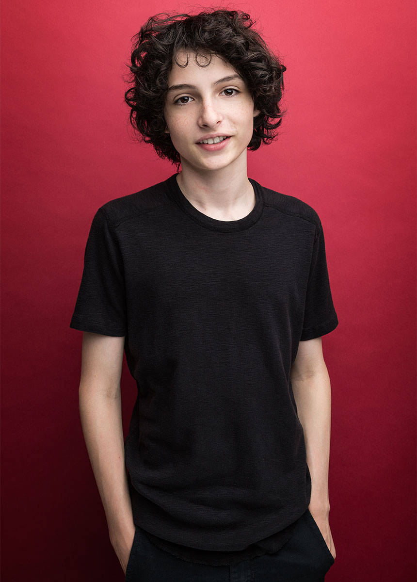 Finn Wolfhard, curly dark hair, black t-shirt, SD Phone Wallpaper