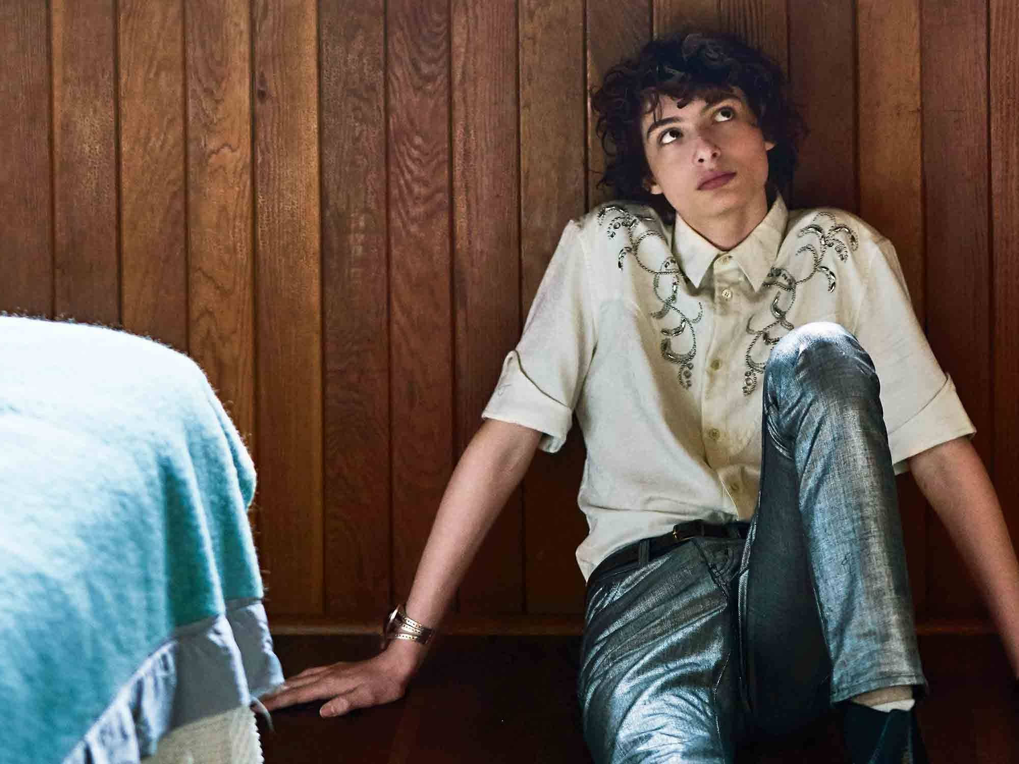 Finn Wolfhard, curly hair, wooden wall, Full HD Desktop Wallpaper