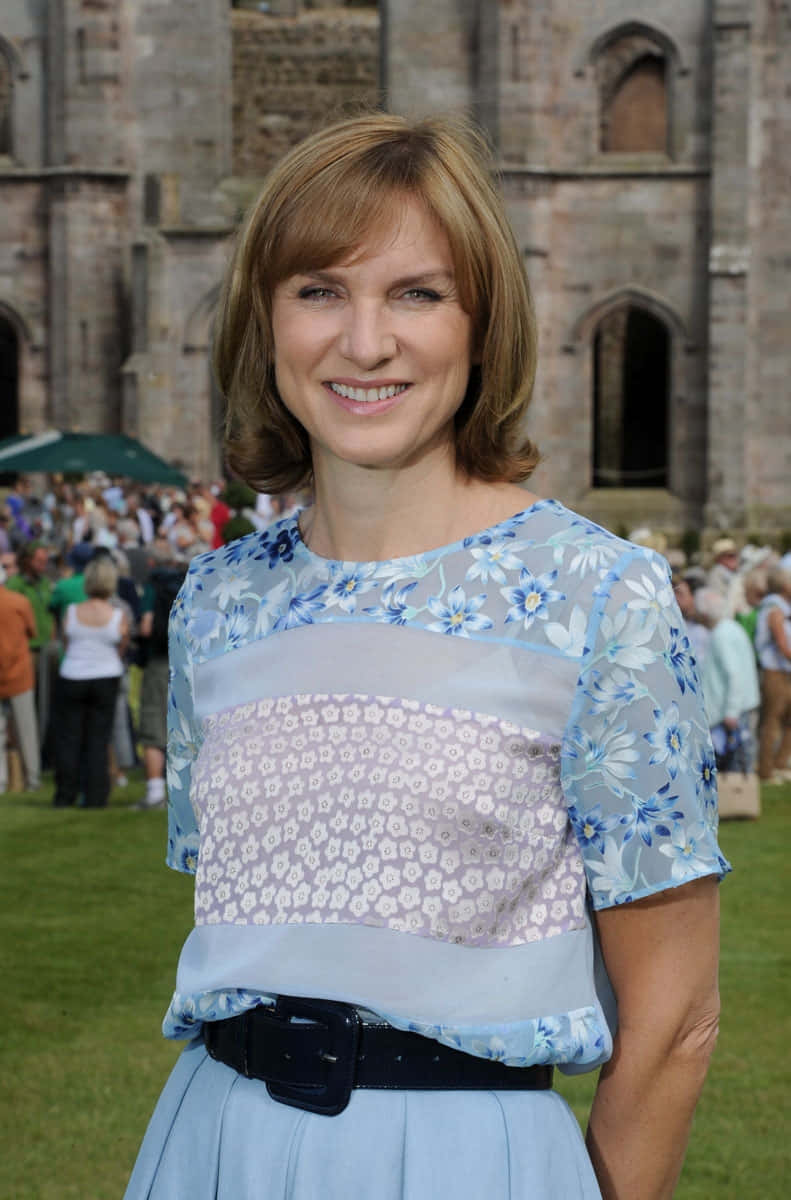 Fiona Bruce, blue floral blouse, light blue skirt, SD Phone Wallpaper