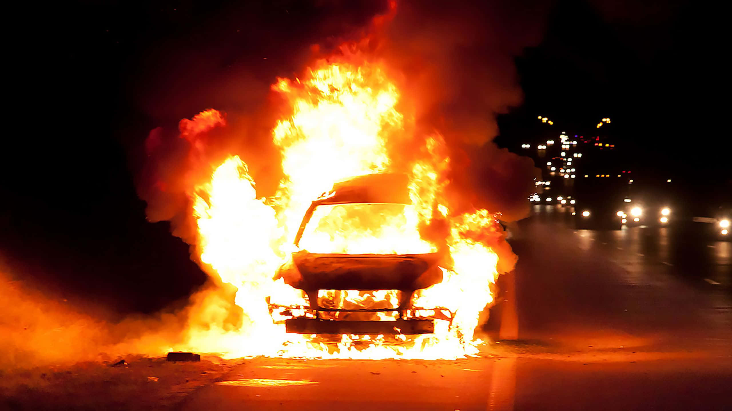 fire car, dark road, city lights, 2K Desktop Wallpaper