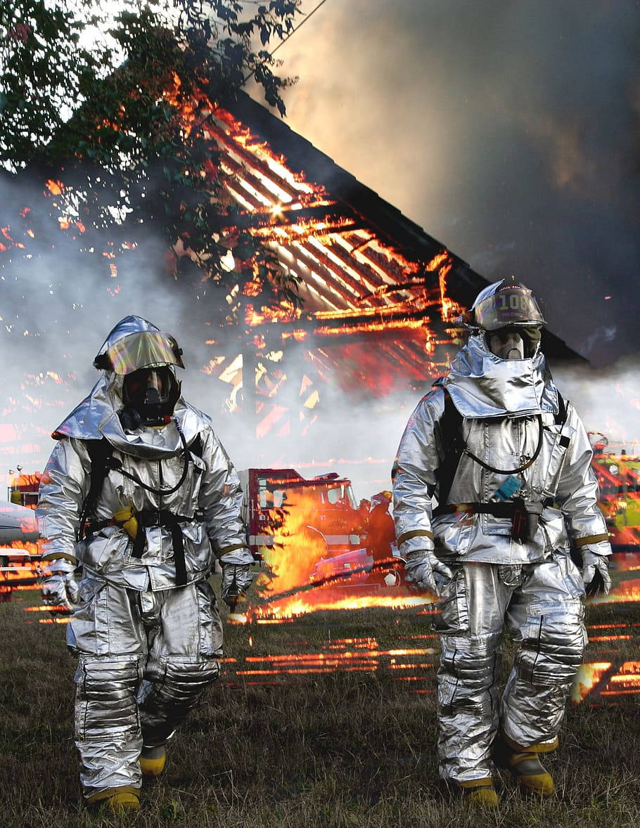 Fireman, silver tunic, burning site, SD Phone Wallpaper