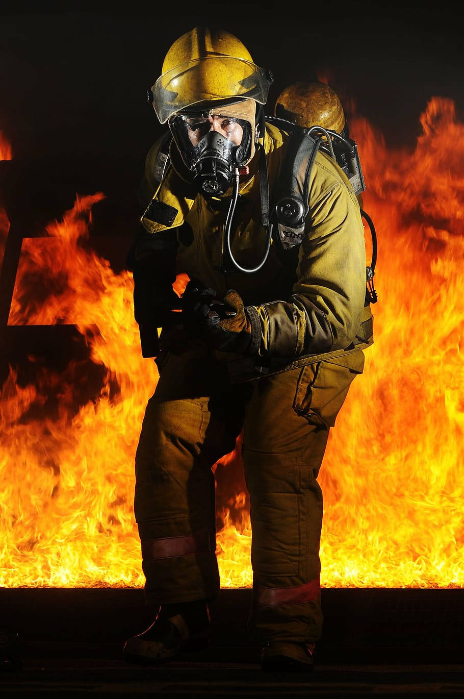 Fireman, full gear, roaring wall of orange flames, HD Phone Wallpaper