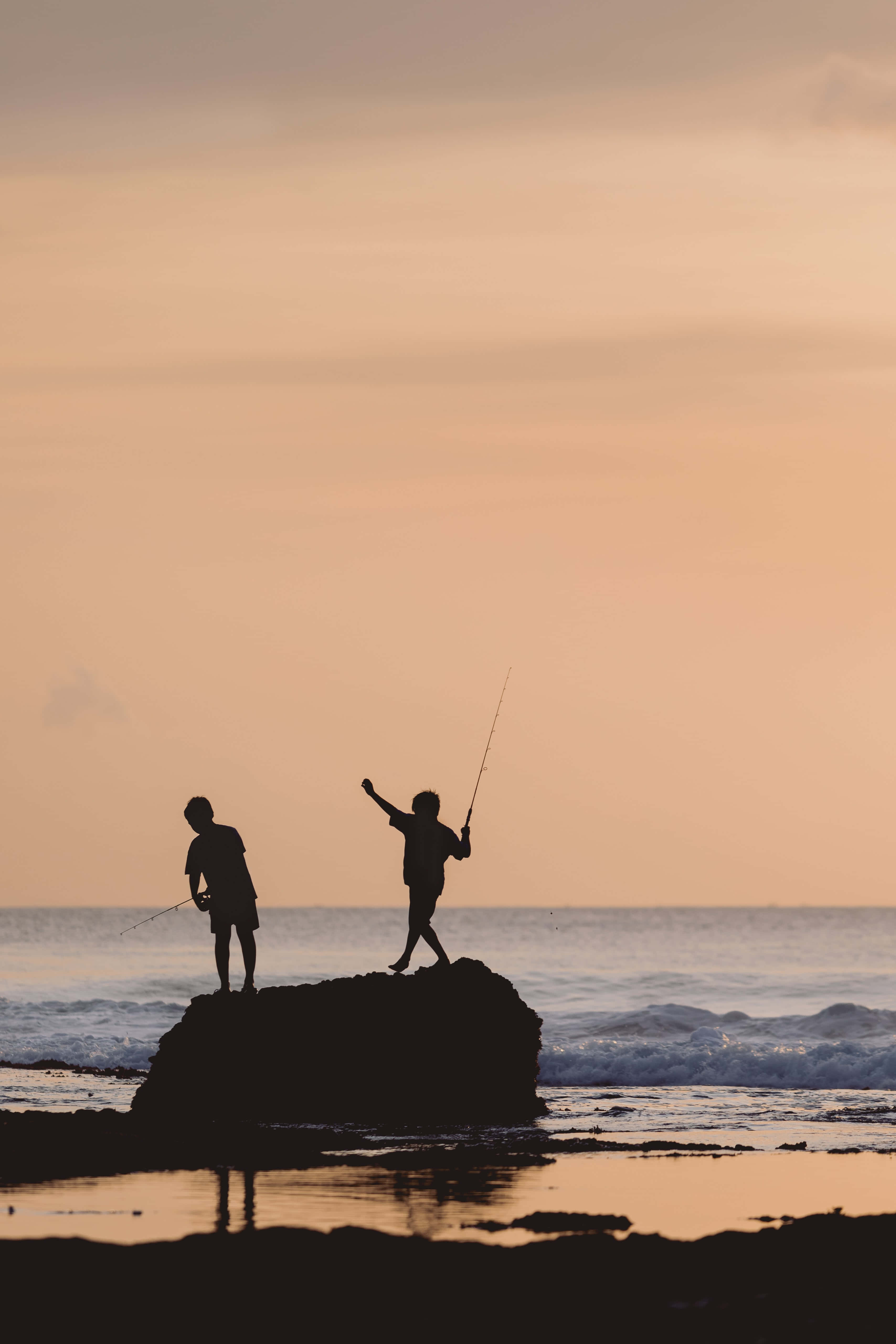 Fishing Phone, sunset, rocky outcrop, 5K Phone Wallpaper