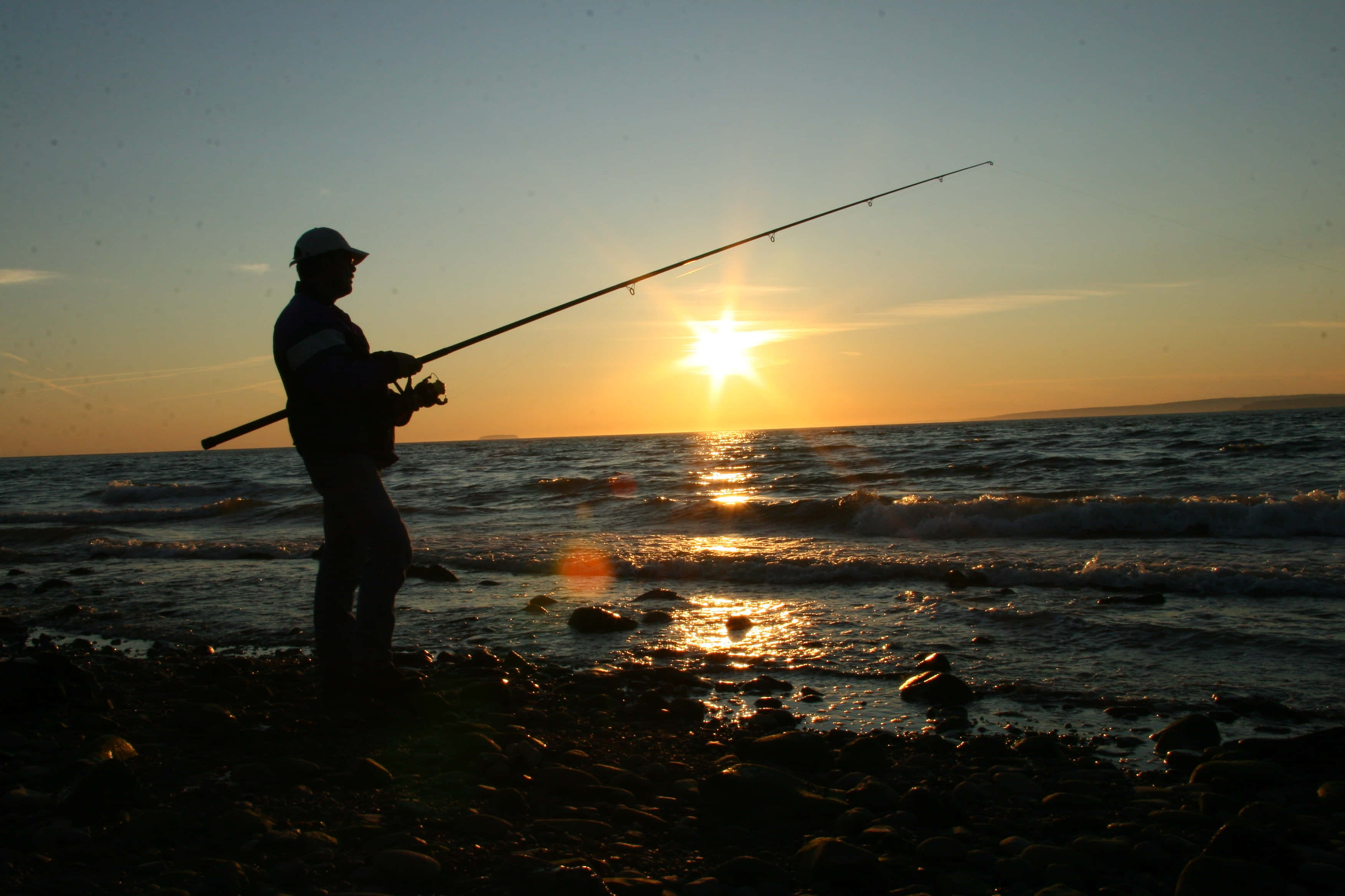 Fishing Rod, sunset, rocky shoreline, 2K Desktop Wallpaper