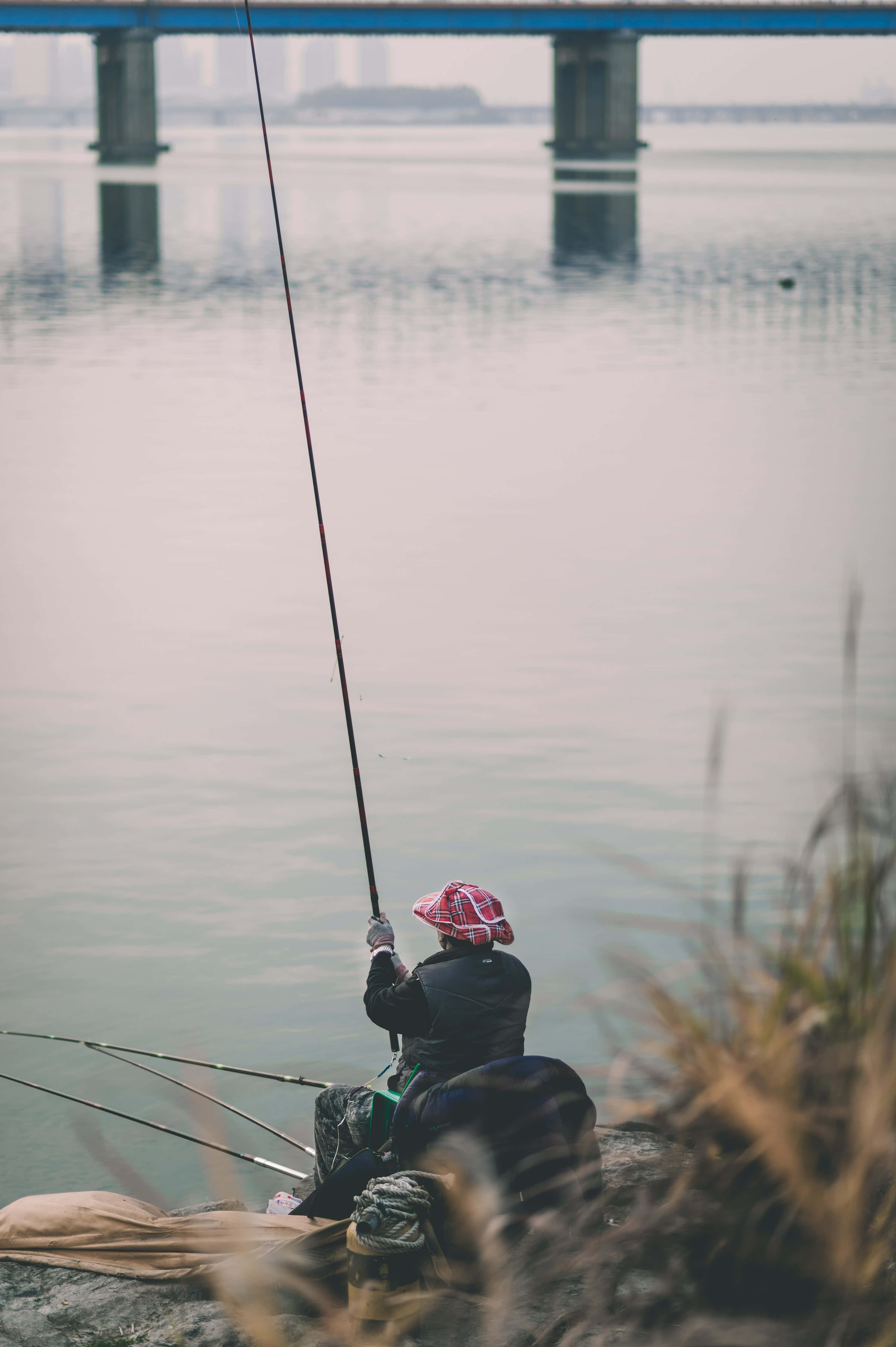 fishing phone, red plaid hat, rocky shore, 4K Phone Wallpaper