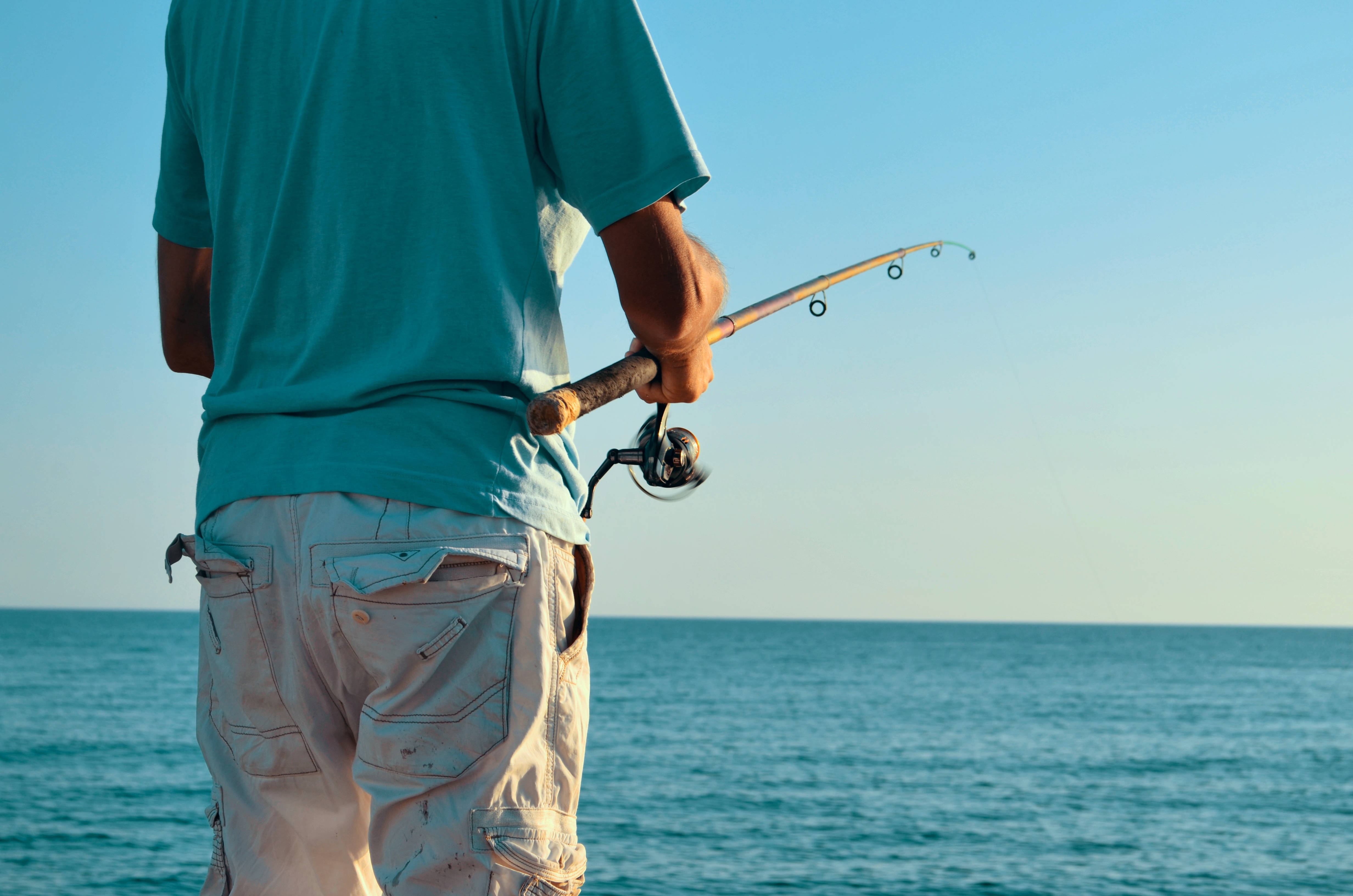fishing man, teal shirt, beige pants, 4K Desktop Wallpaper