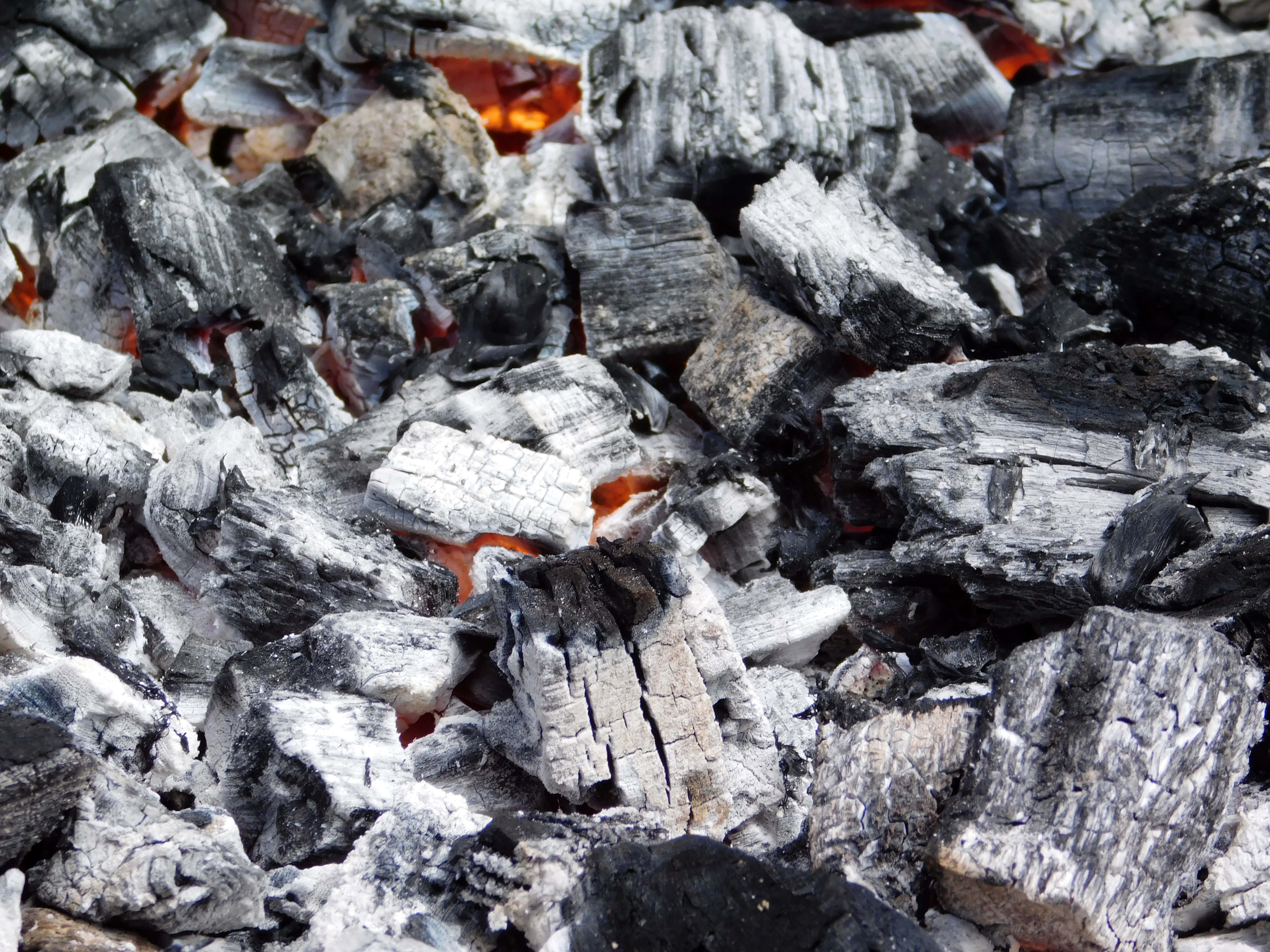 glowing embers, charred wood fragments, bright orange flames, 4K Desktop Wallpaper