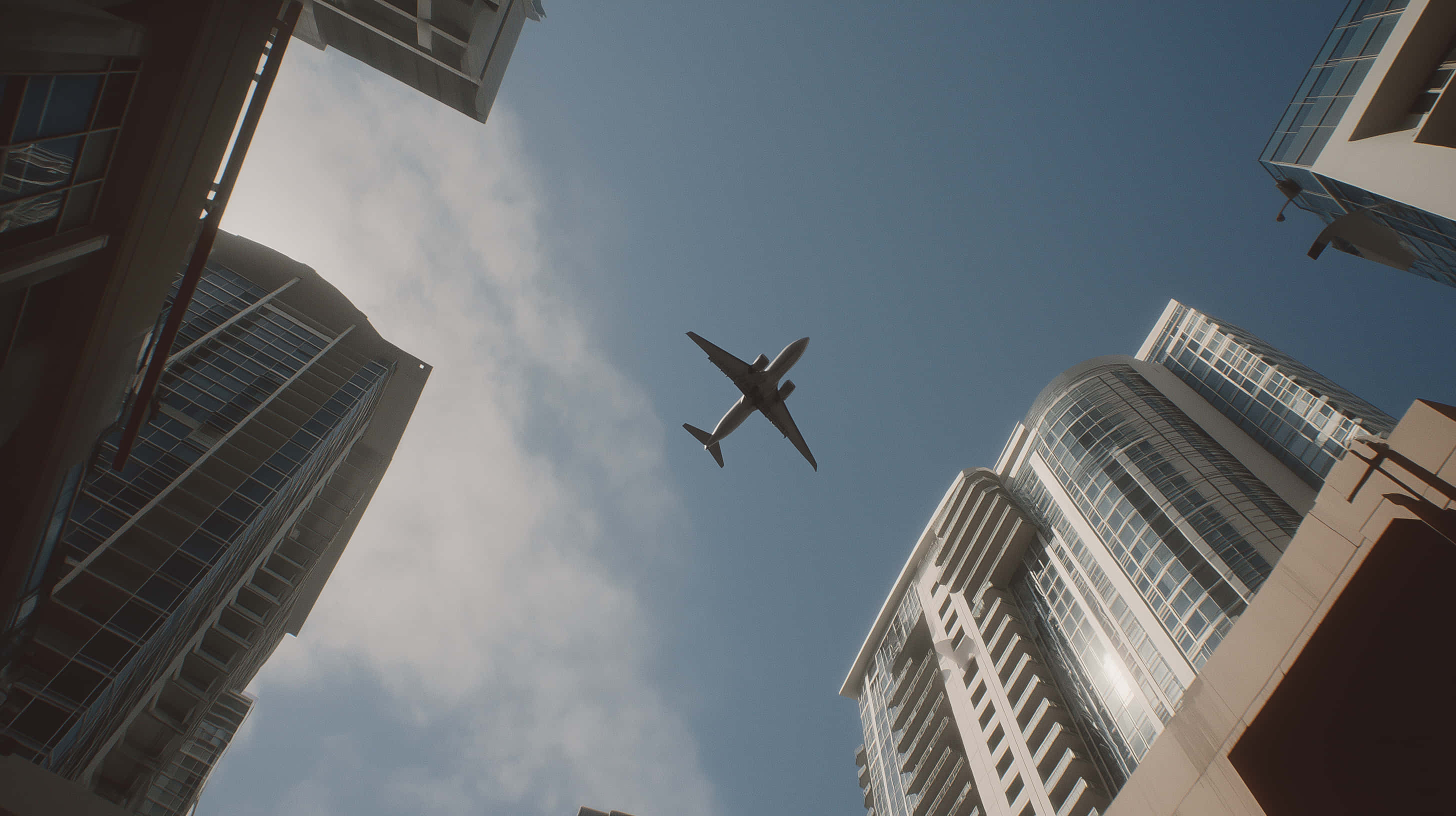 commercial airplane, towering glass skyscrapers, partly cloudy blue sky, 2K Desktop Wallpaper