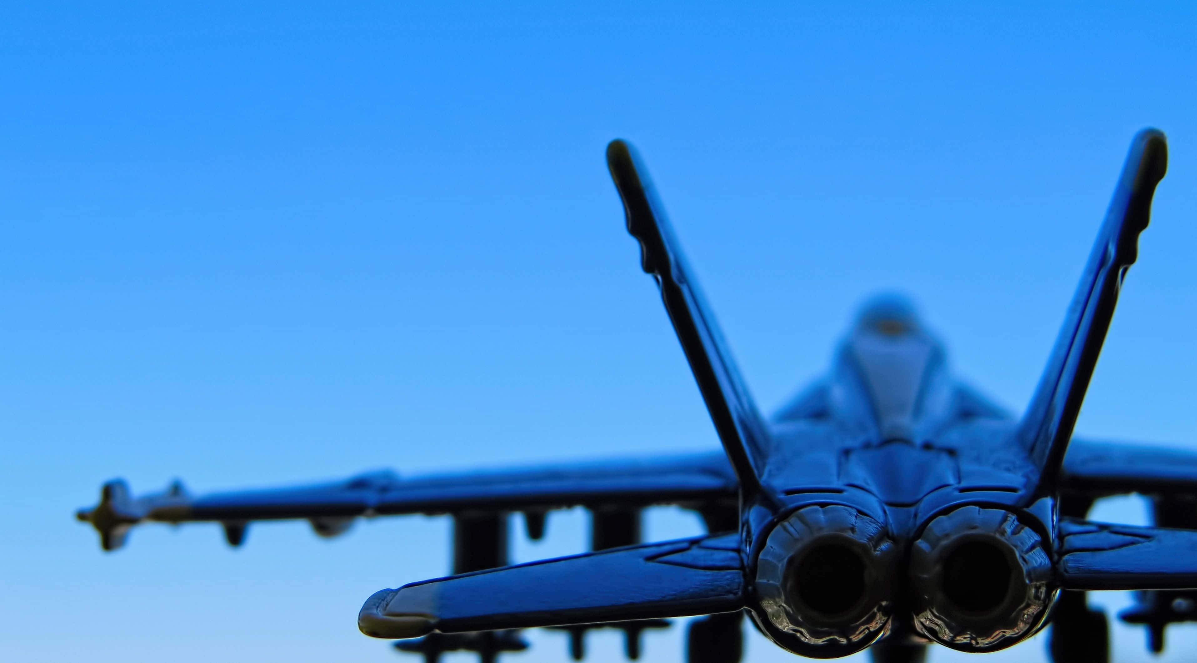 fighter jet model, clear blue sky, shallow depth of field, 2K Desktop Wallpaper