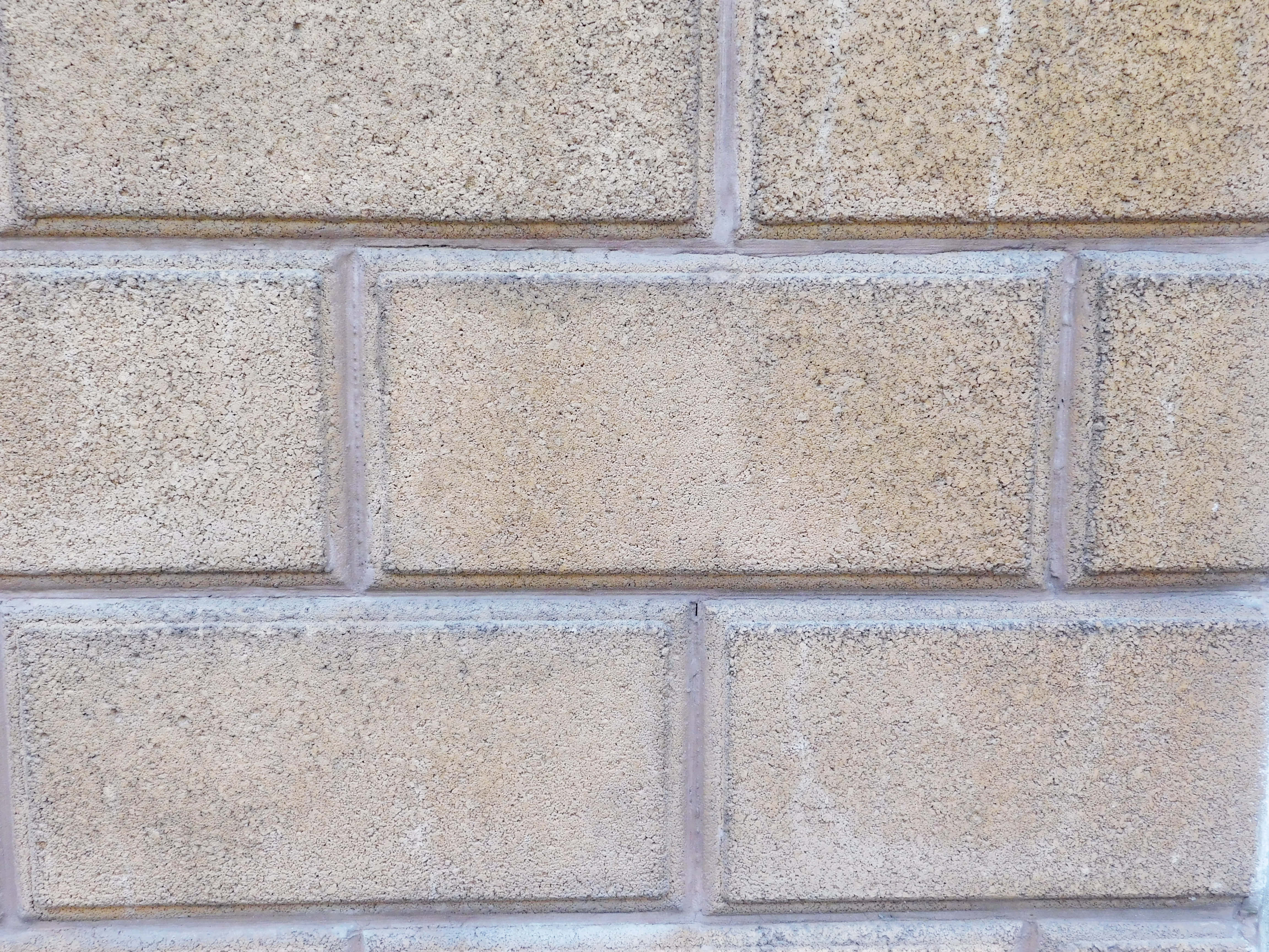 beige textured concrete blocks, gray mortar lines, repeating grid pattern, 4K Desktop Wallpaper