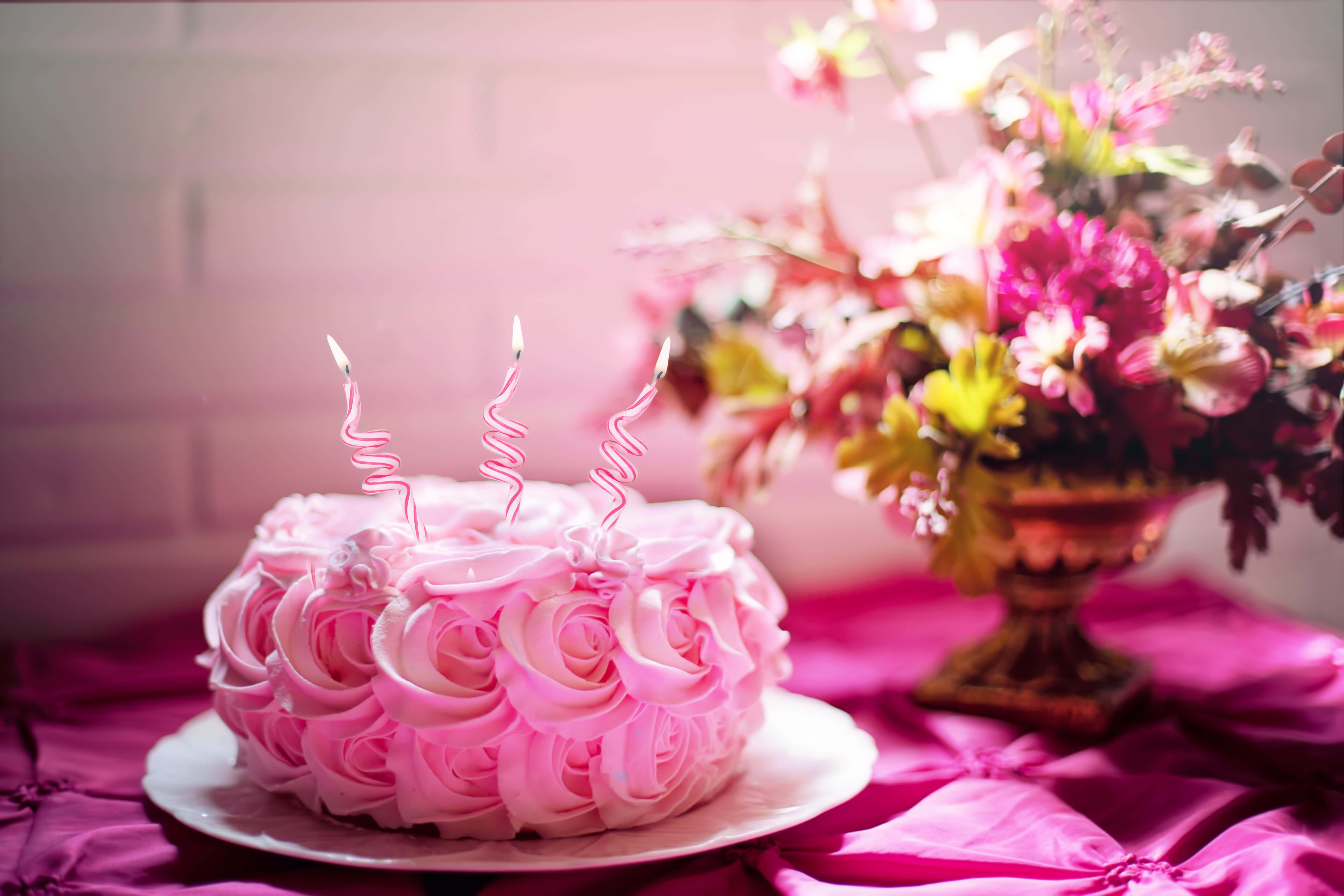 floral cake, pink rose-shaped birthday cake, three lit spiral candles, 5K Desktop Wallpaper