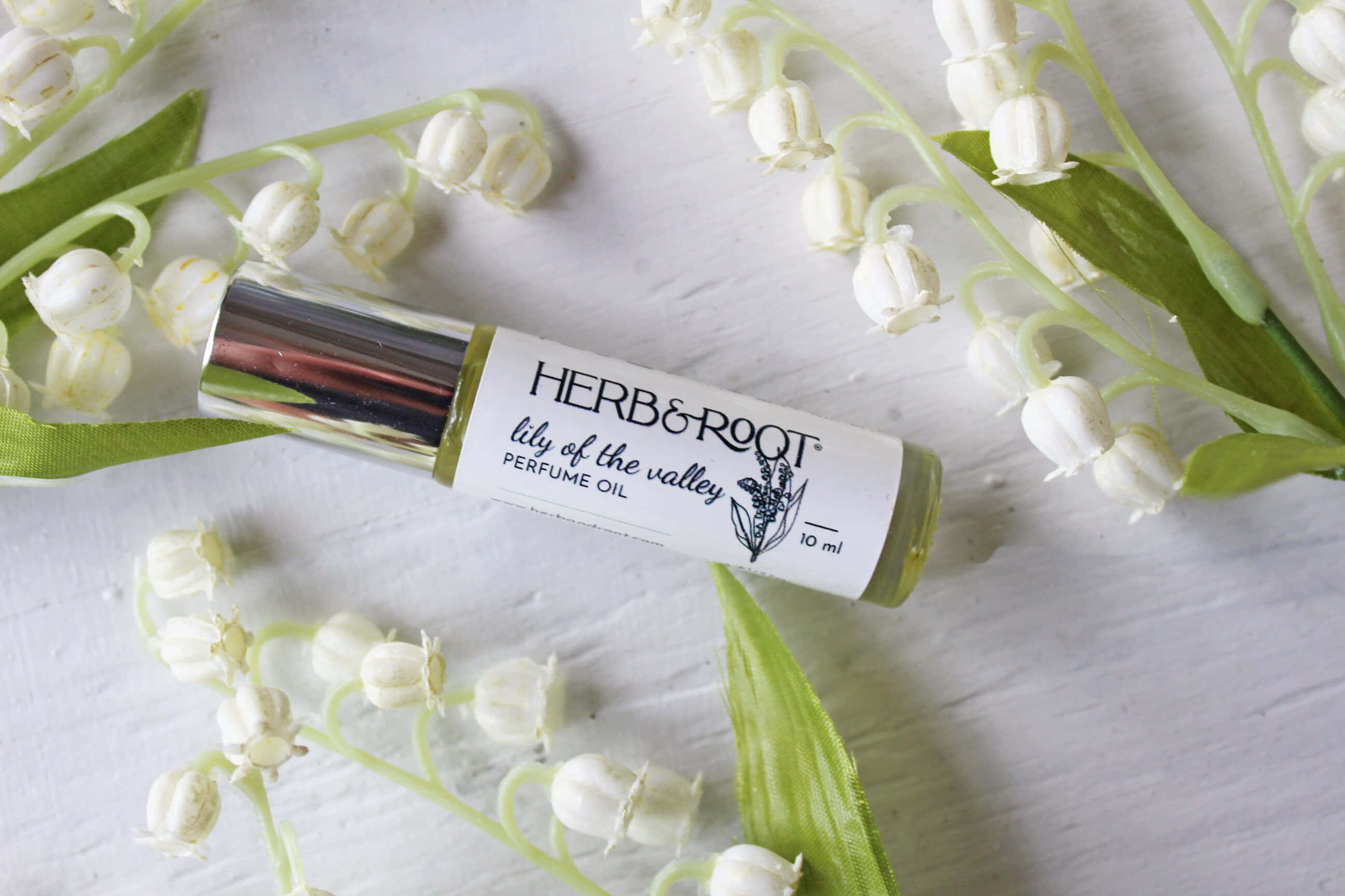 lily of the valley, silver roll-on perfume oil, white bell-shaped flowers, 2K Desktop Wallpaper