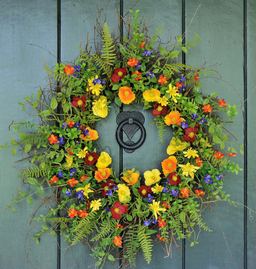 Colorful Floral Wreathon, blue door, yellow red and blue blossoms, SD Phone Wallpaper