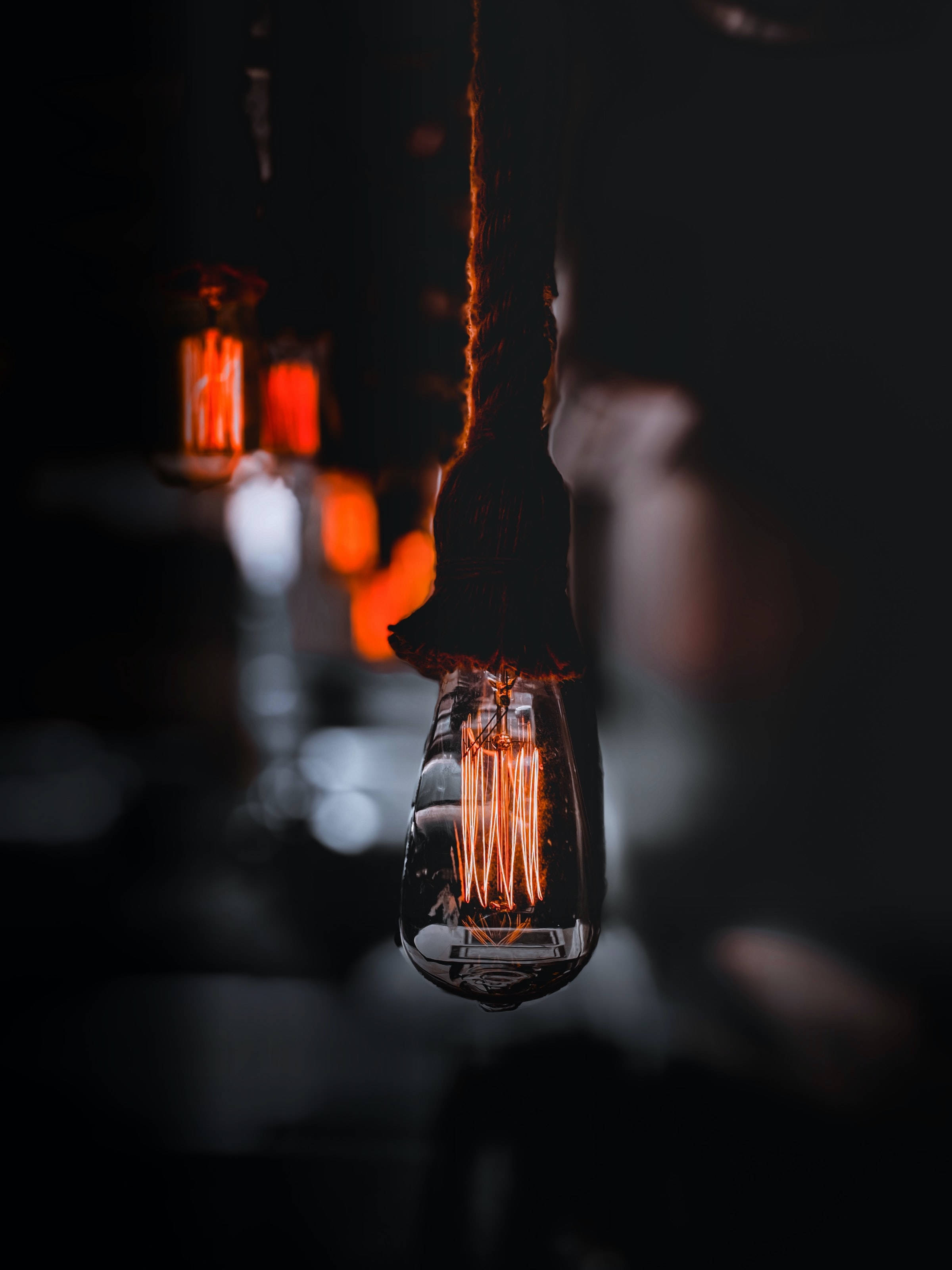 vintage Edison bulb, thick rope, dark backdrop, 2K Phone Wallpaper