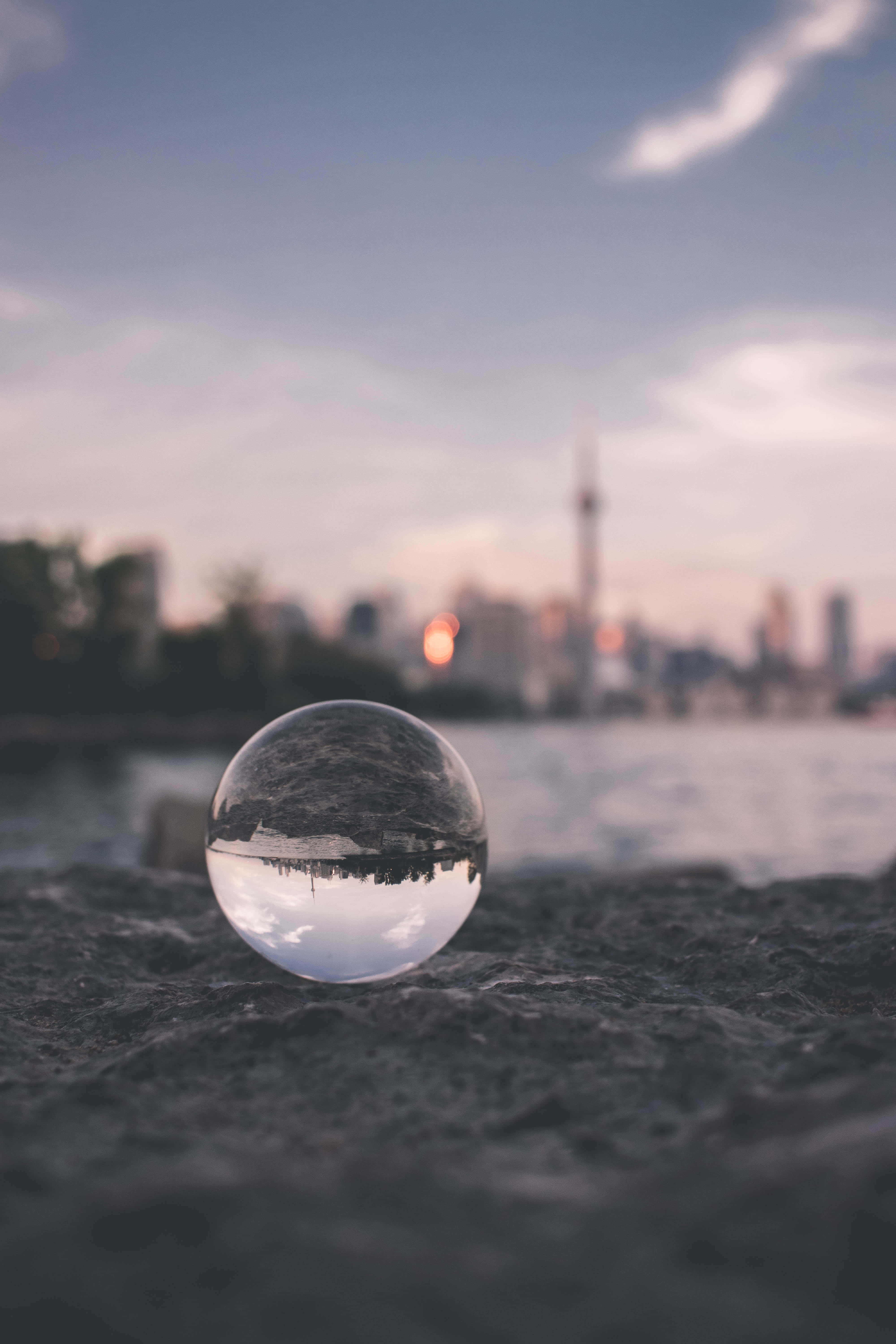Focused Glass, clear glass sphere, rocky shore, 5K Phone Wallpaper