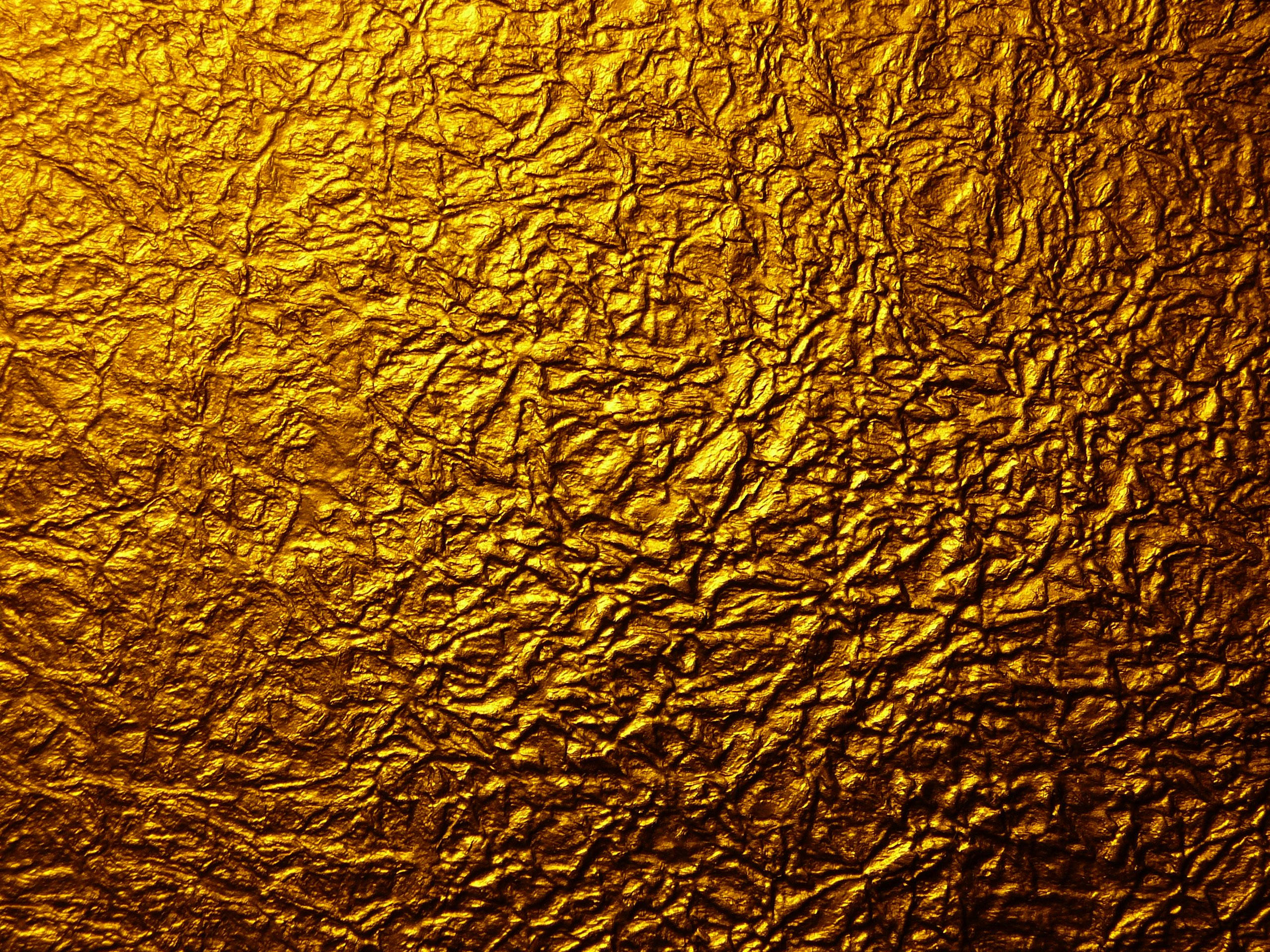 gold foil, rough surface, warm highlights, 2K Desktop Wallpaper